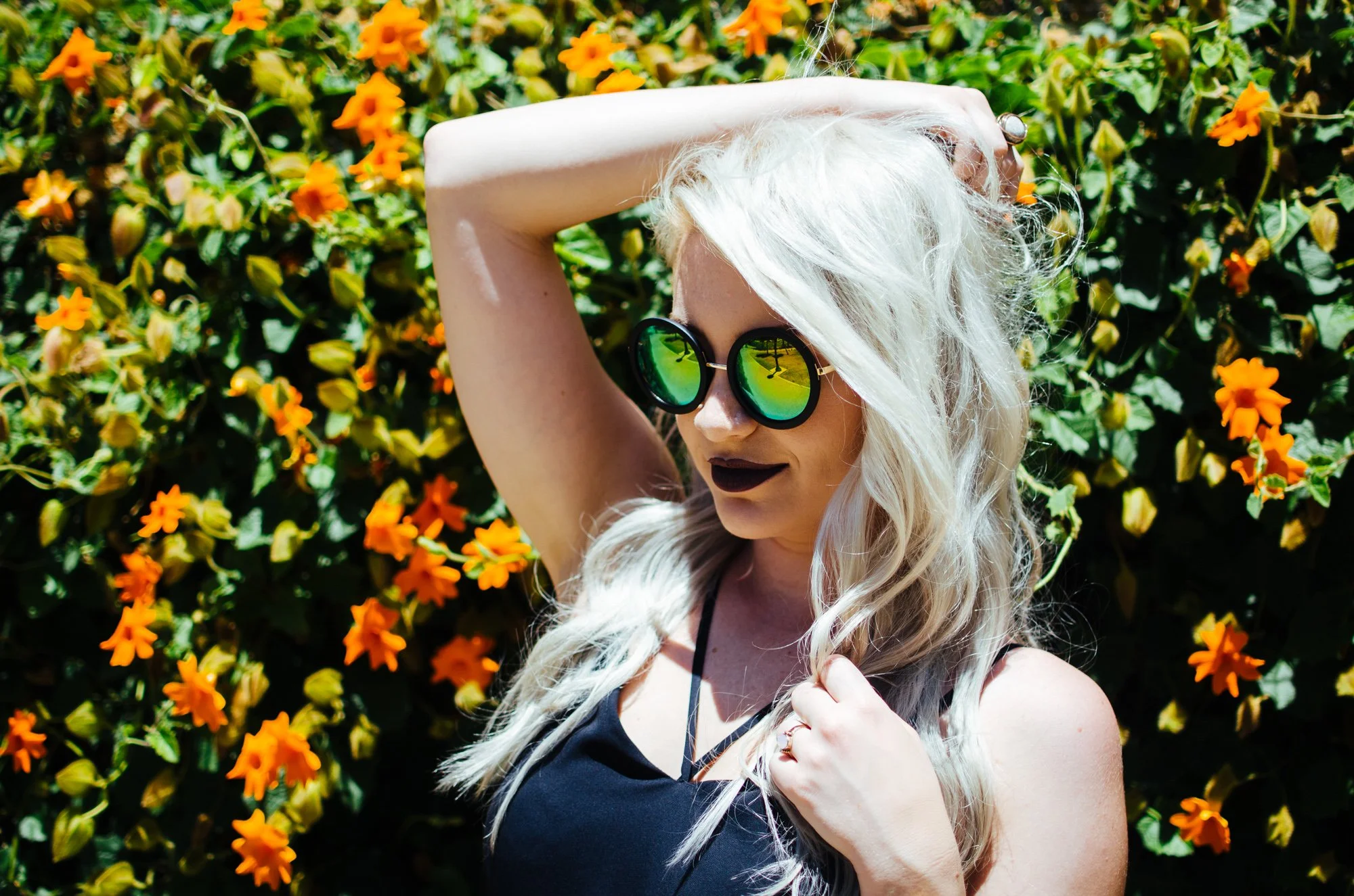 BT72-blonde-woman-sunglasses-orange-flowers.jpg