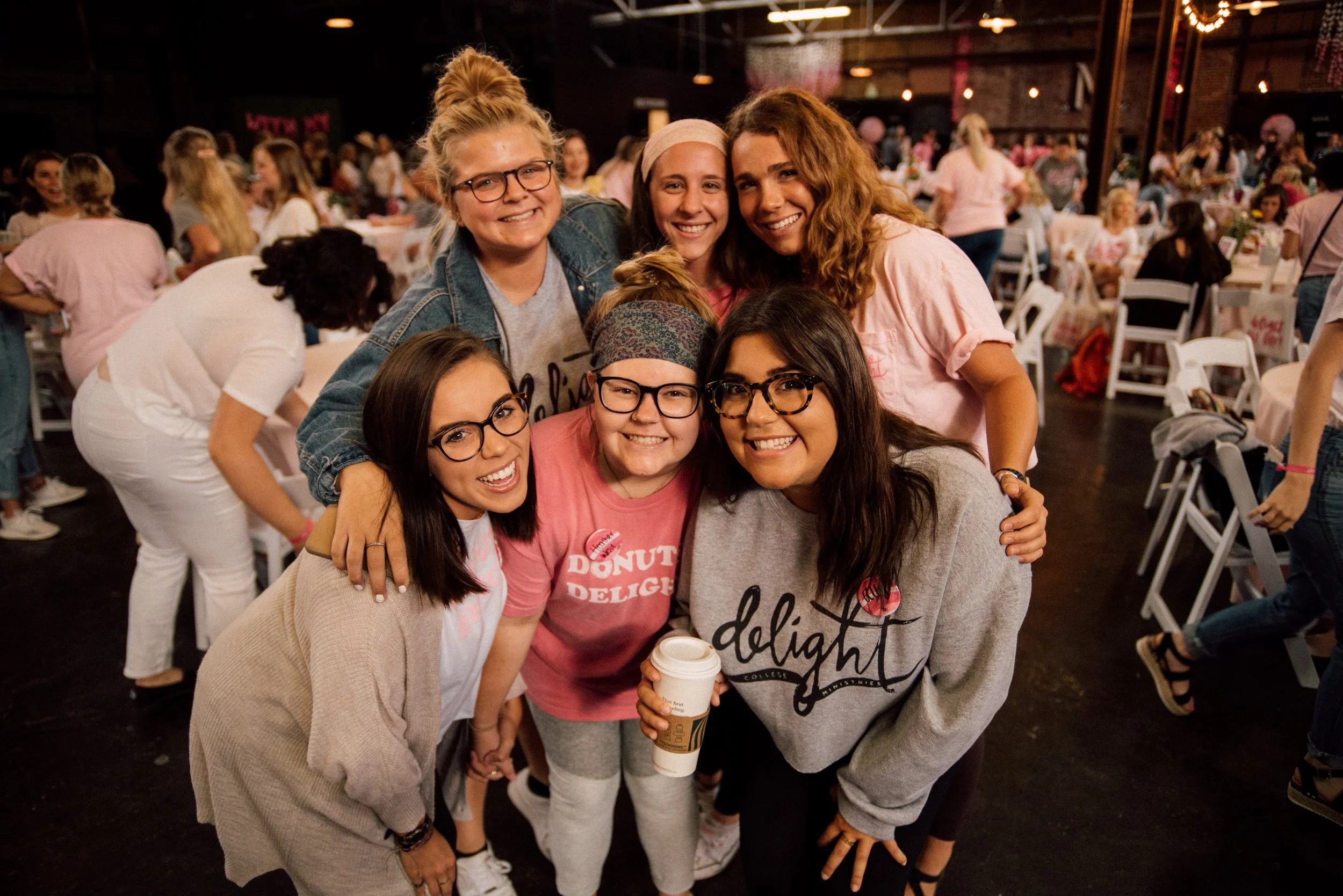 d296-women-posed-smiling-at-conference.jpg