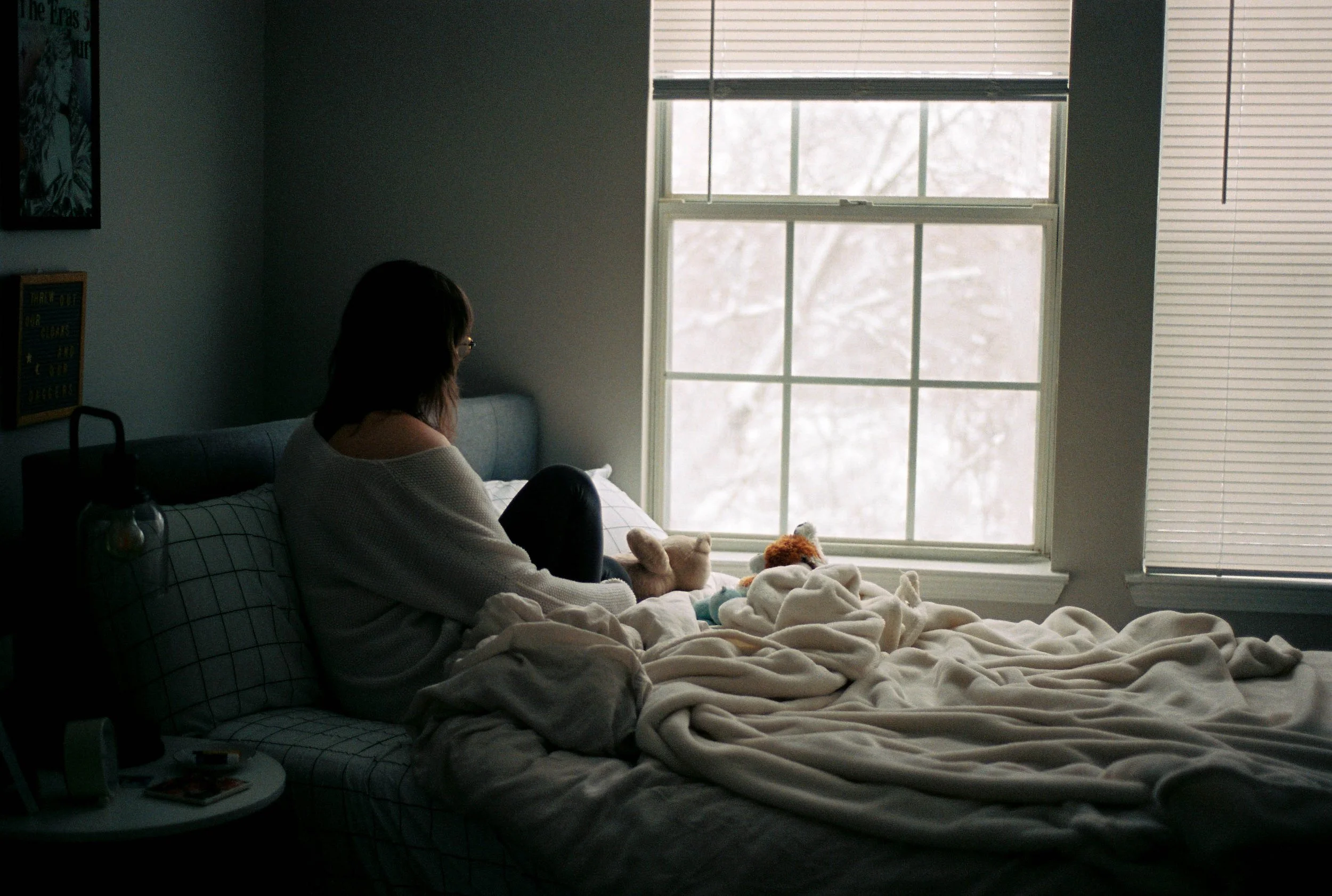 week-03-woman-in-bed-by-window-snow.jpg