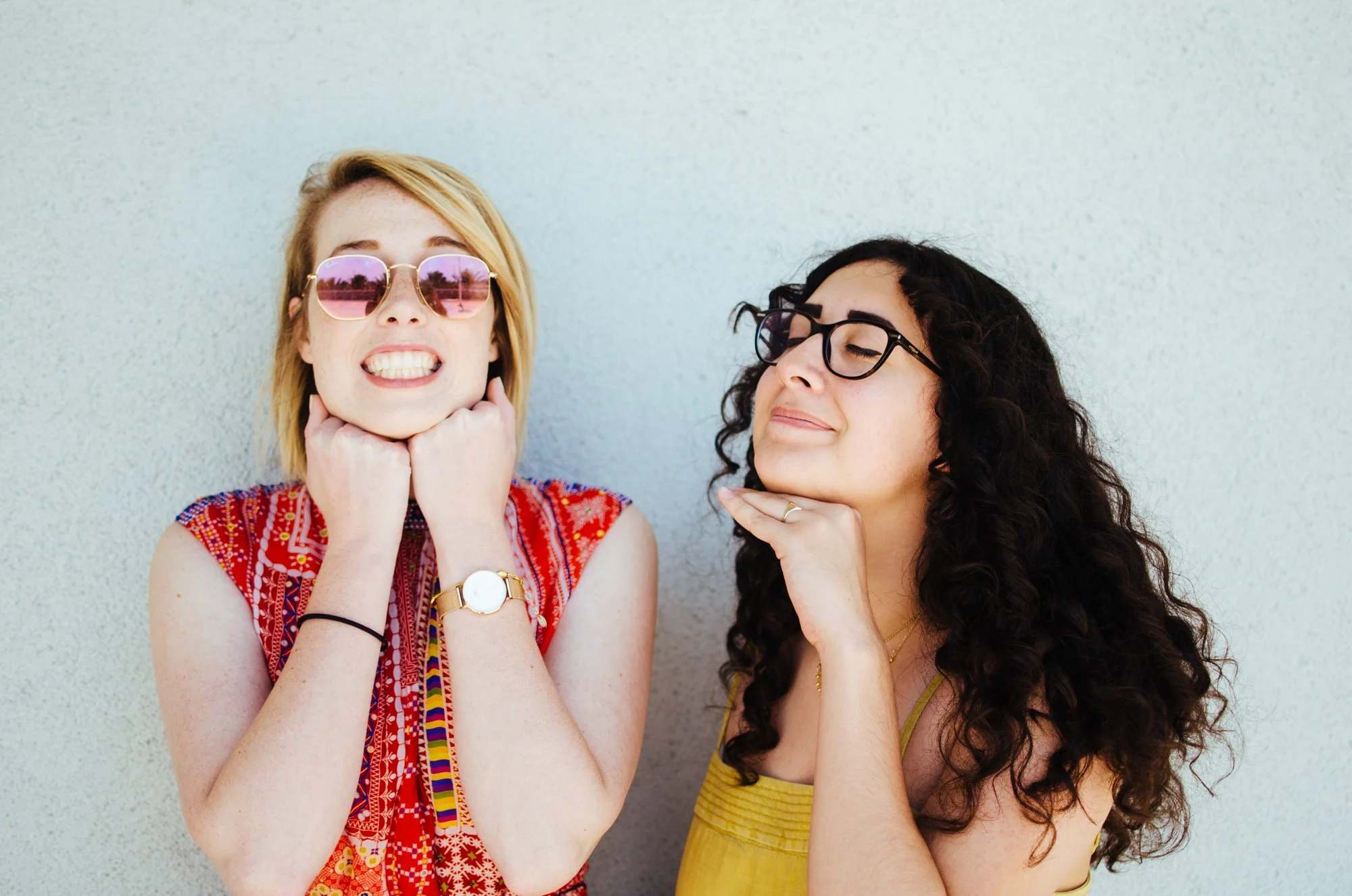 BT39-two-women-smiling-hands-under-chins.jpg