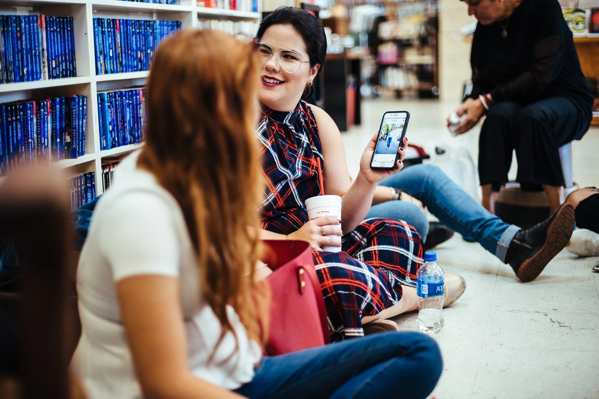 BT224-woman-holding-up-phone.jpg