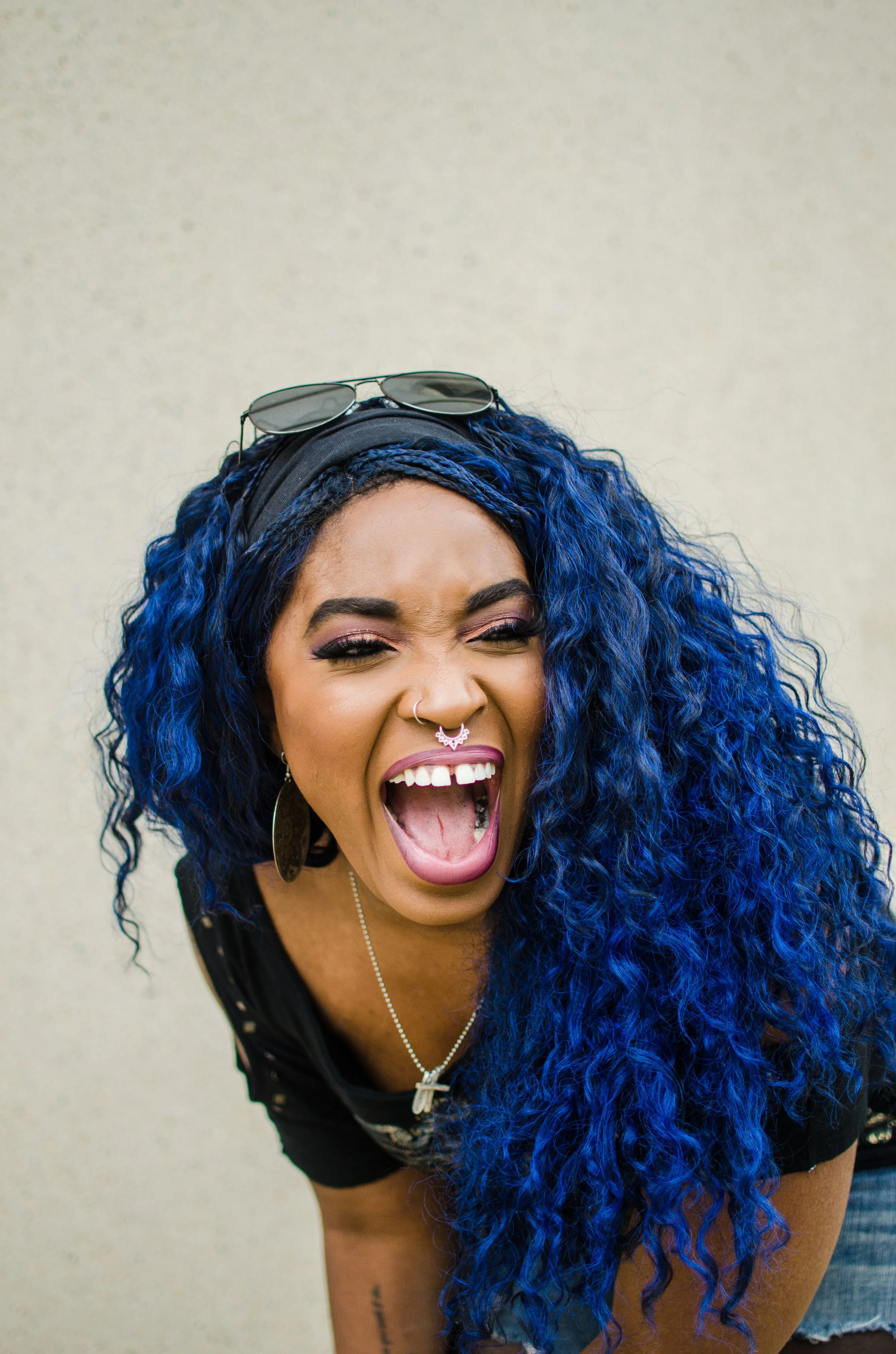 BT75-black-woman-blue-hair-laughing.jpg