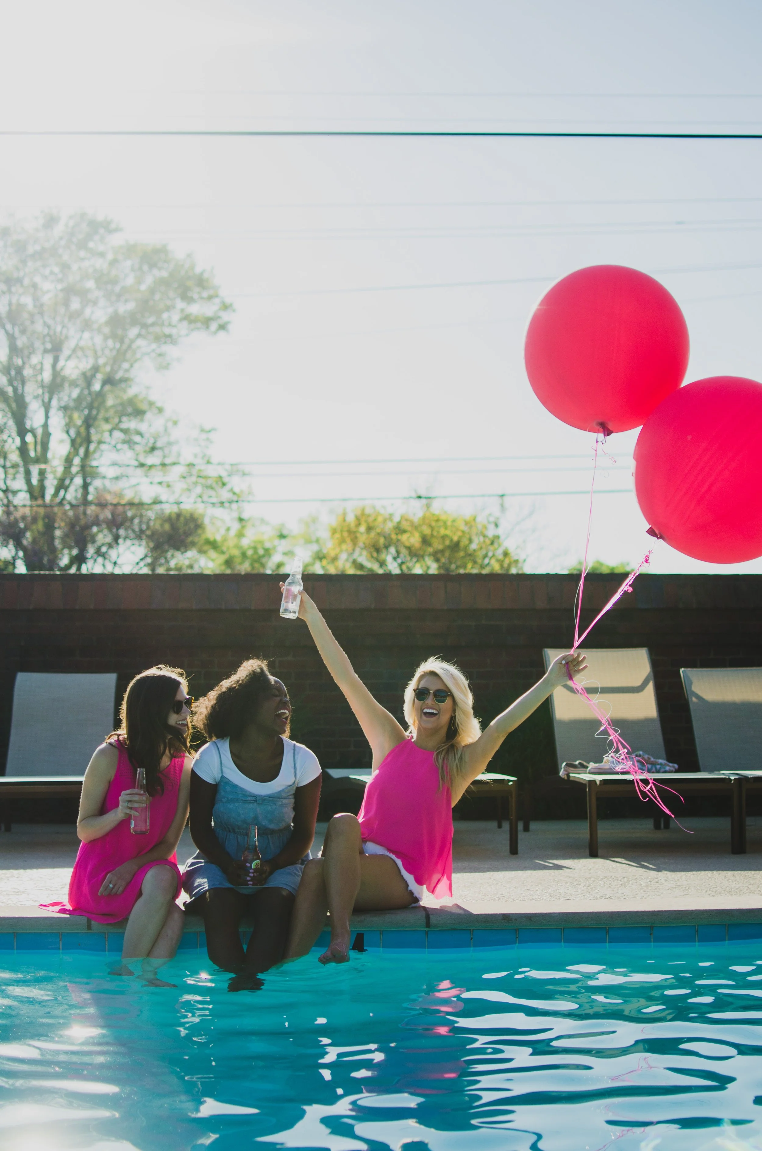 d147-women-sitting-by-pool.jpg