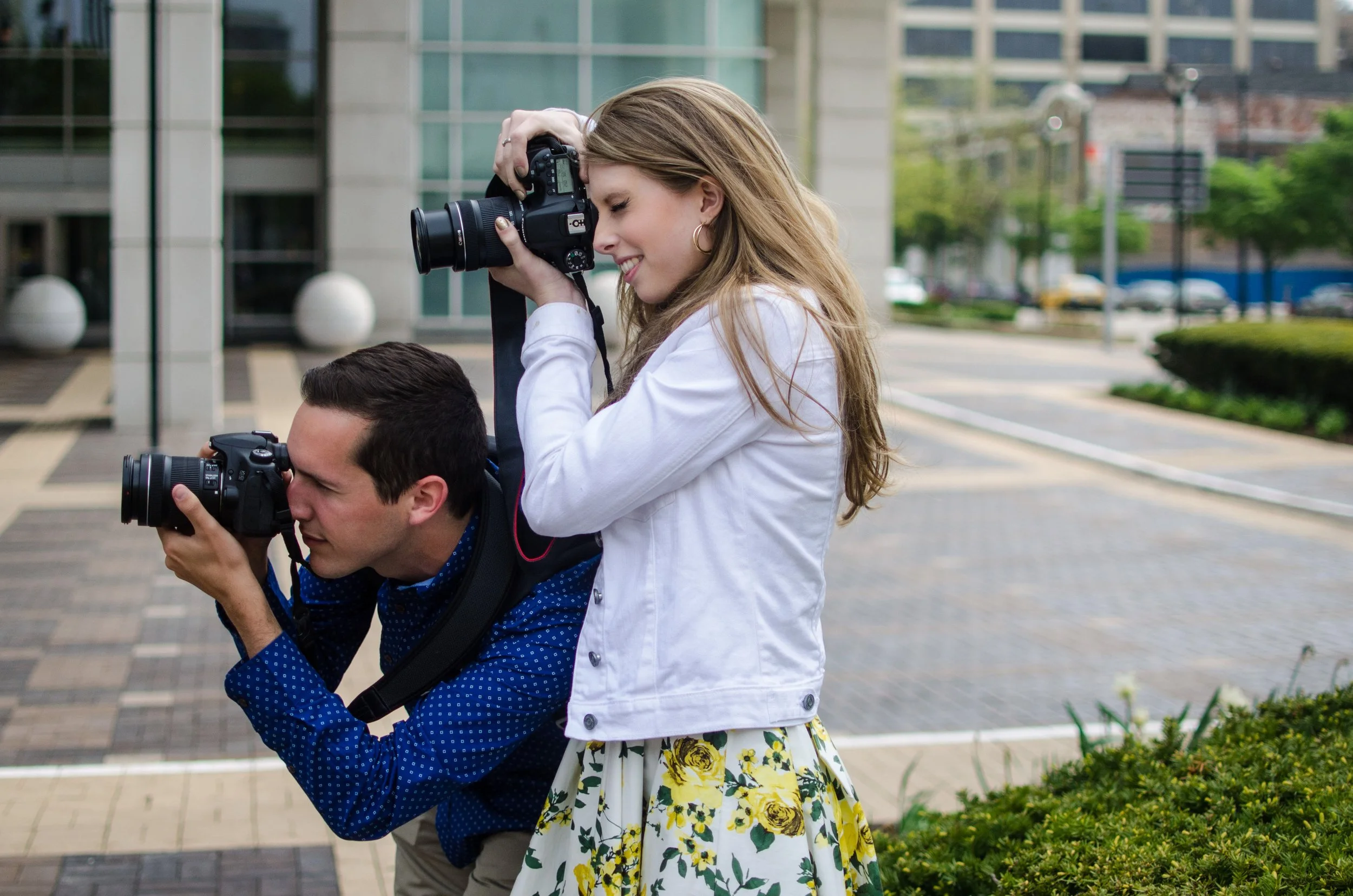 BT29-two-people-holding-cameras.jpg