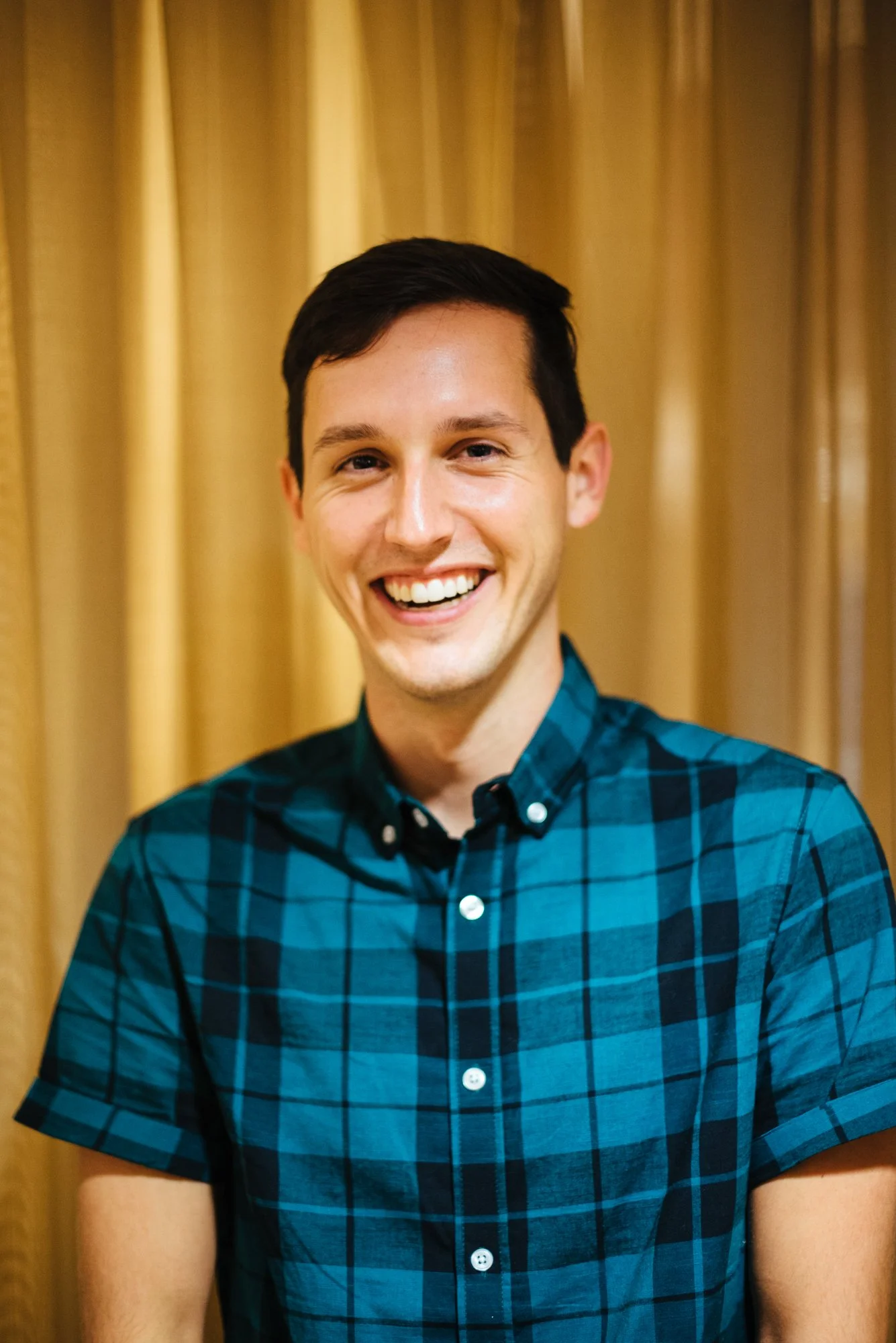BT143-plaid-blue-shirt-man-smiling.jpg