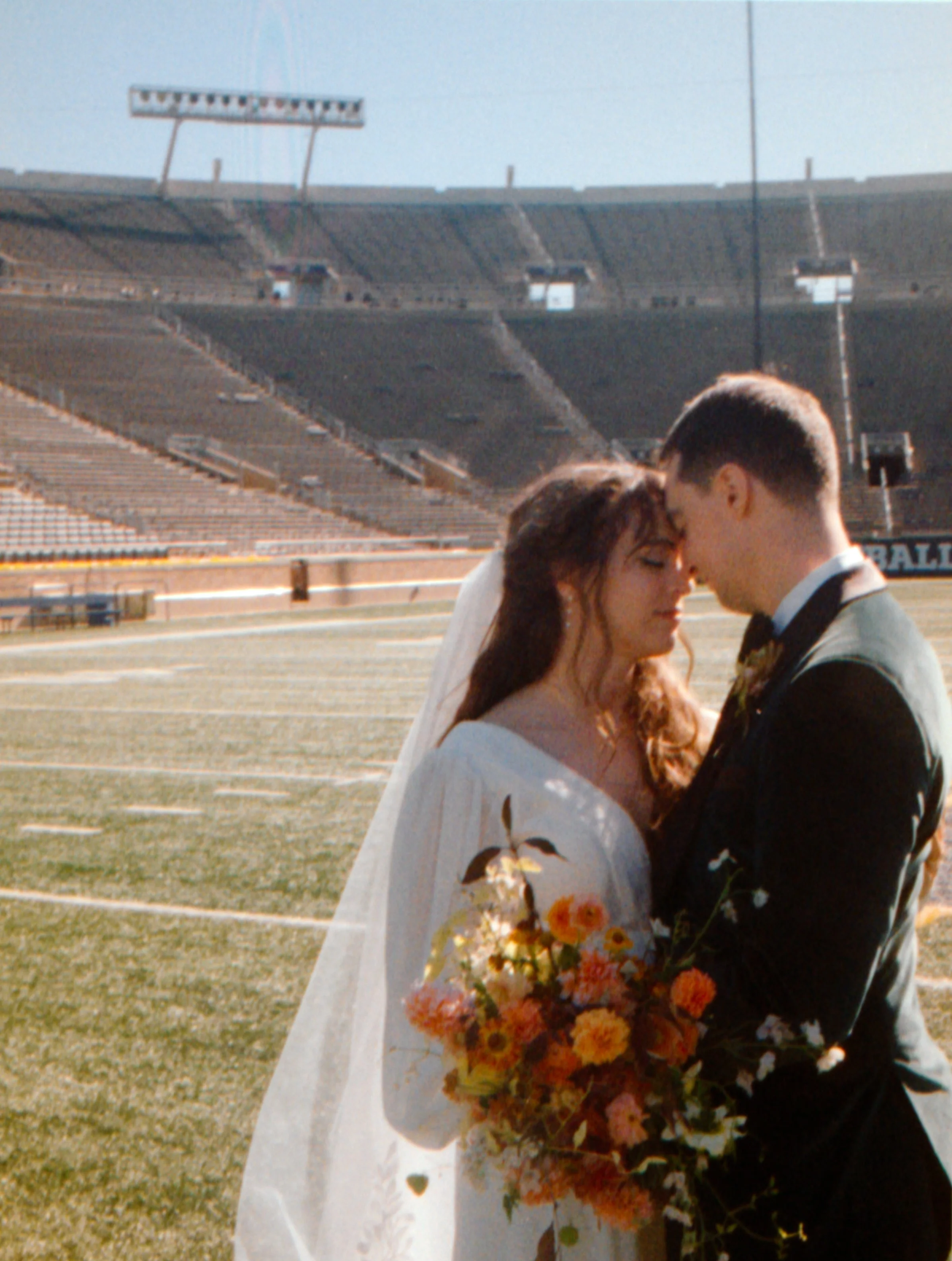 LBW54-wedding-couple-notre-dame-stadium.jpg