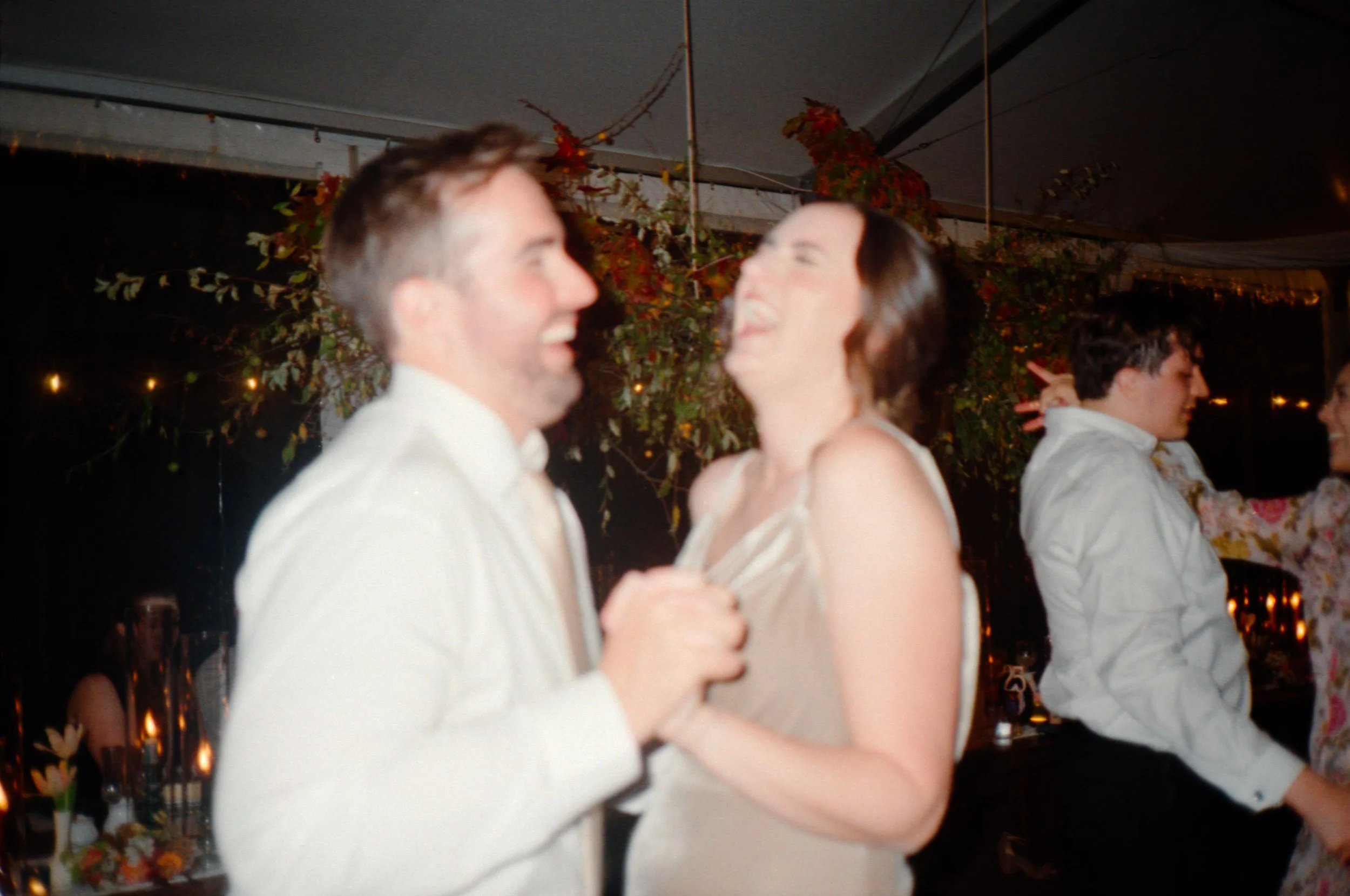 LBW133-couple-laughing-dancing-at-wedding-reception.jpg