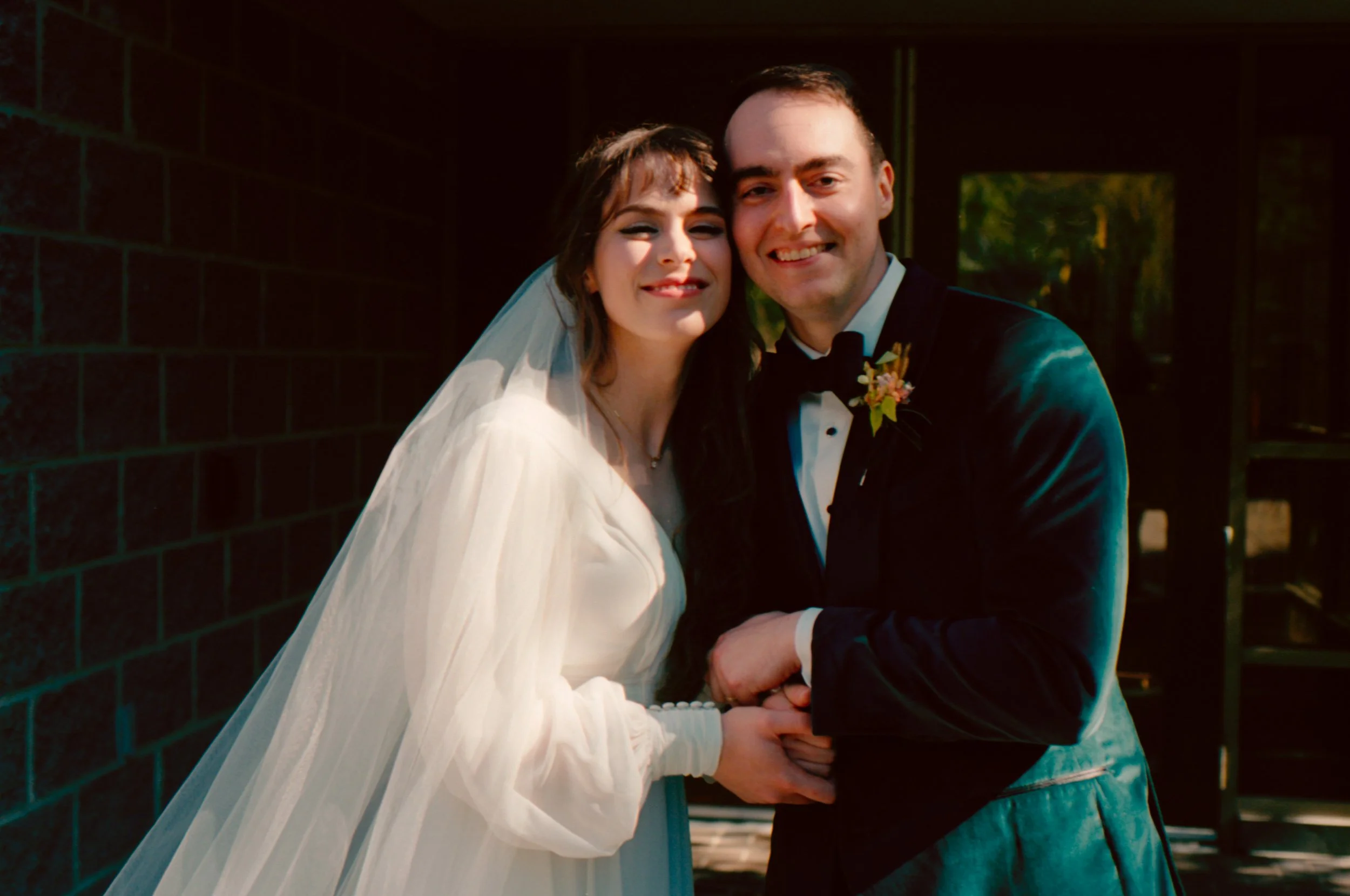 LBW34-bride-groom-holding-each-other-smiling.jpg
