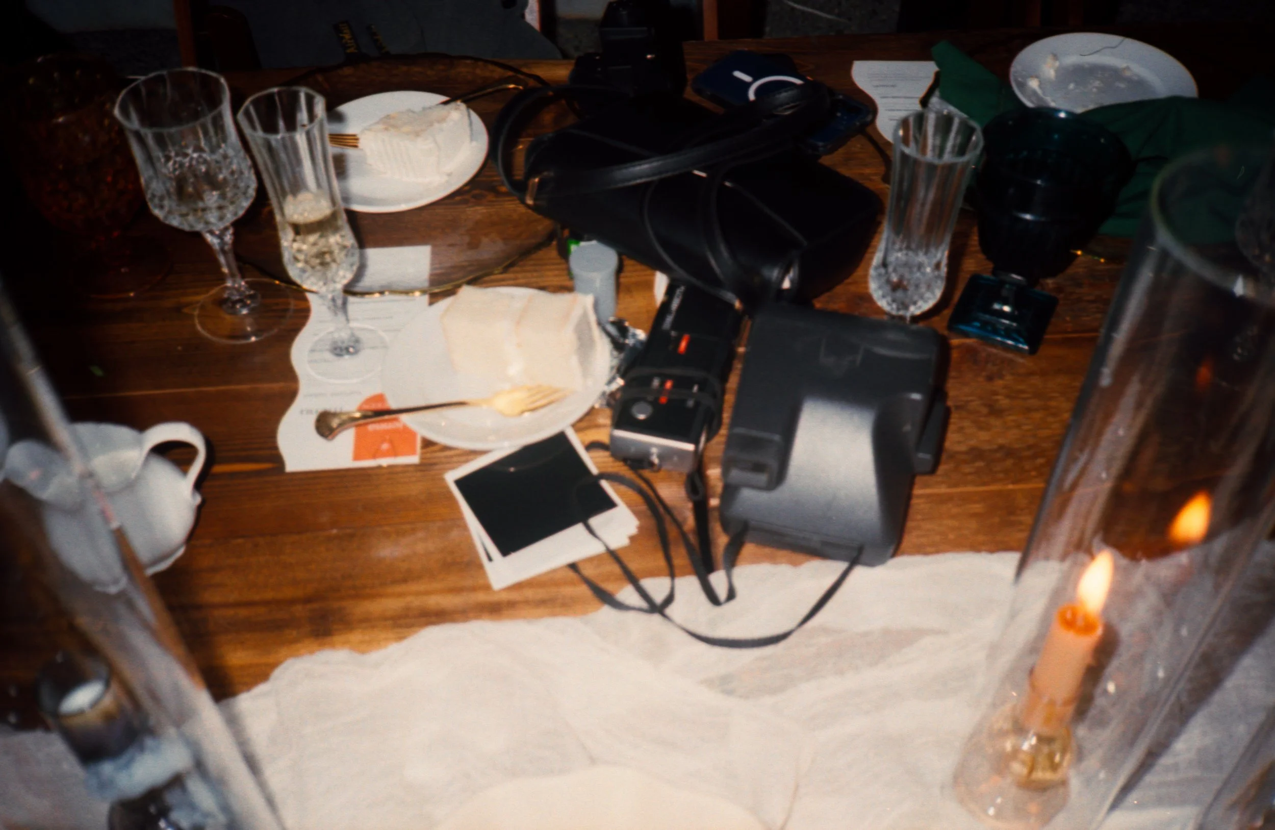 LBW129-wedding-reception-table-cameras-polaroids.jpg