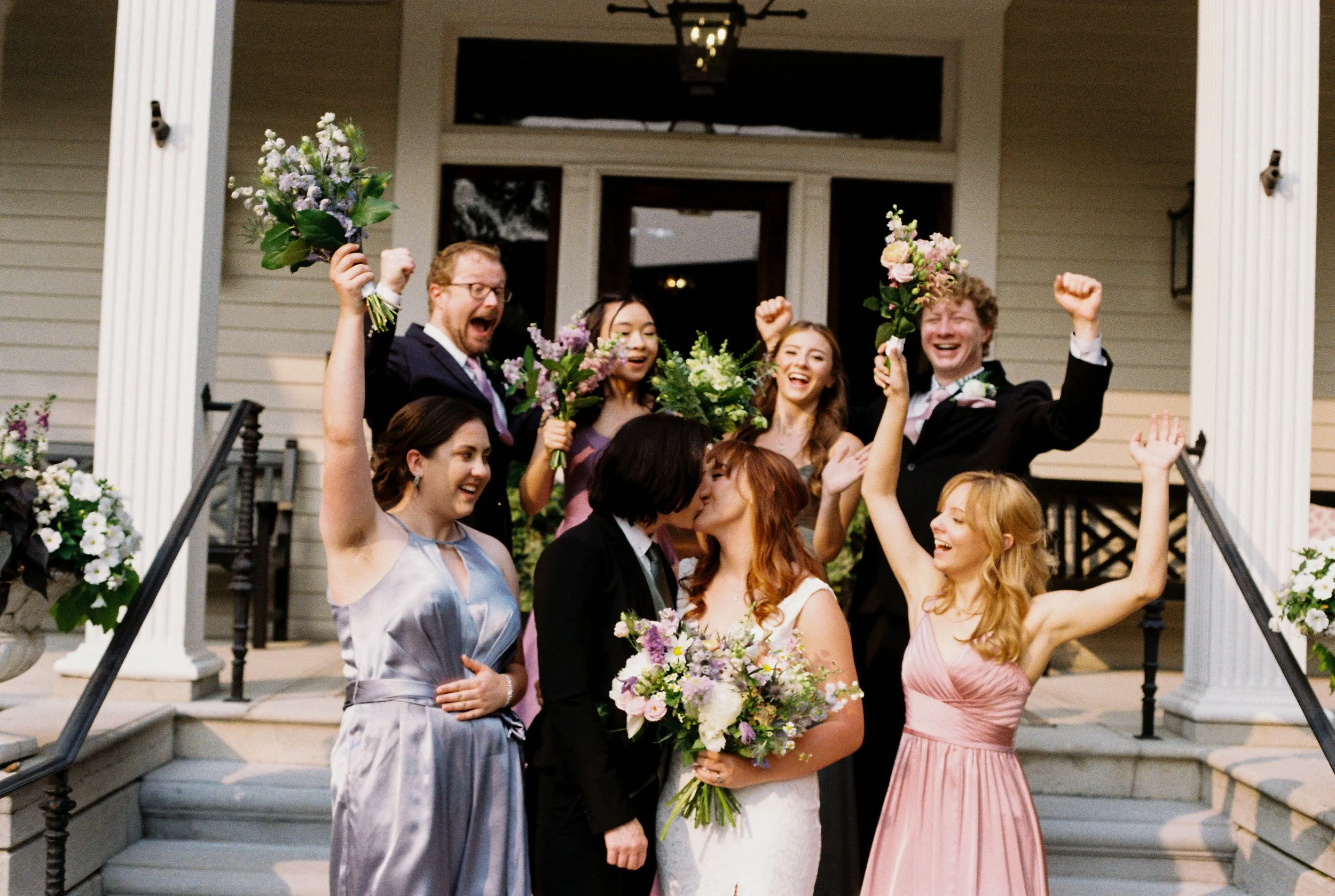 HRF47-wedding-party-two-brides-kissing.jpg