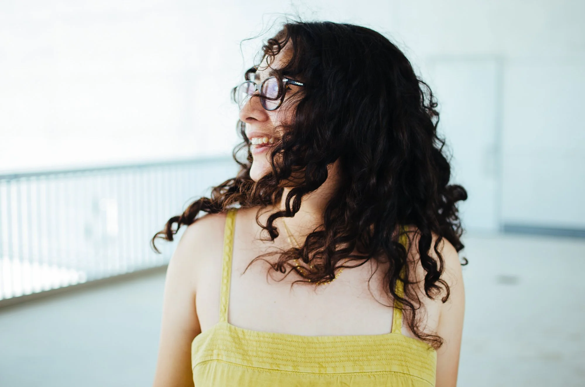 BT40-woman-curly-hair-yellow-top.jpg