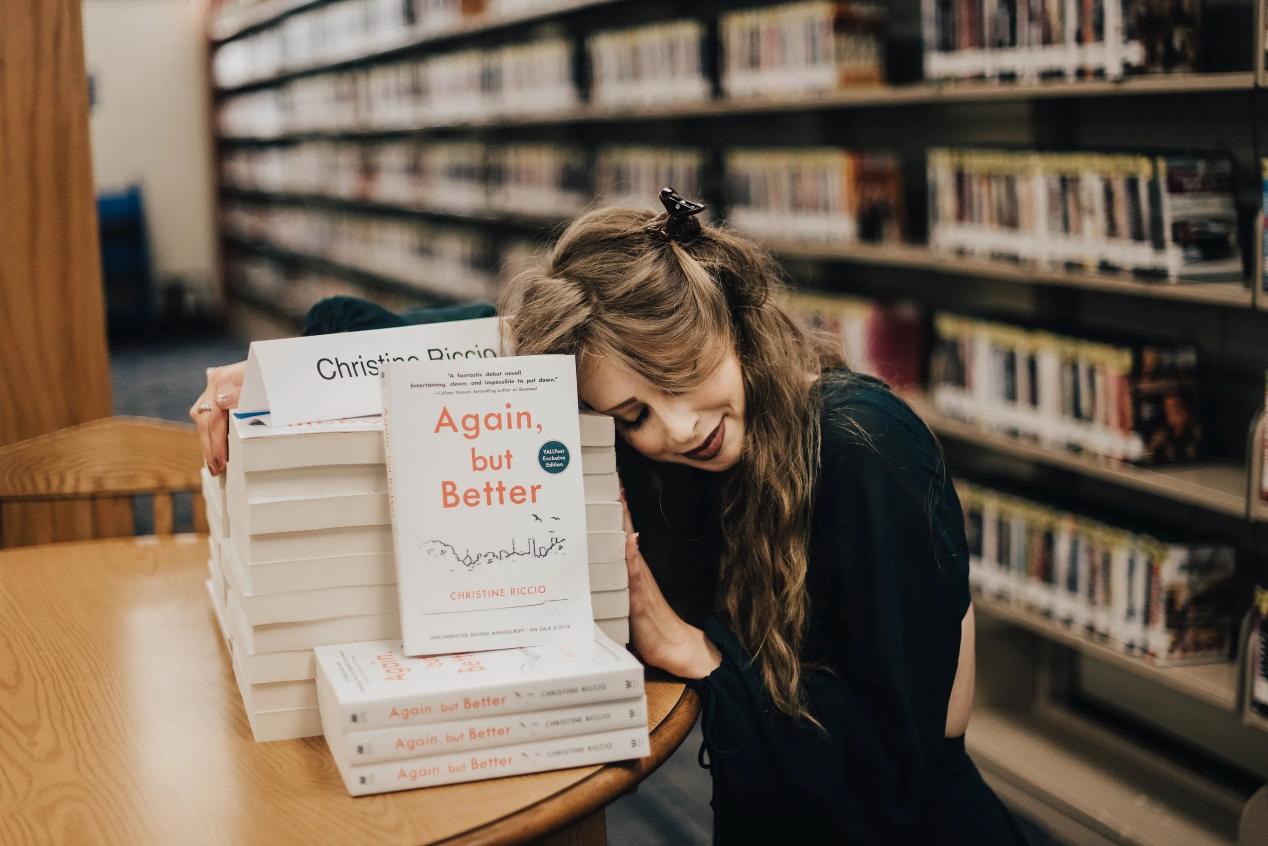 BT155-christine-riccio-with-arcs-again-but-better-books.jpg