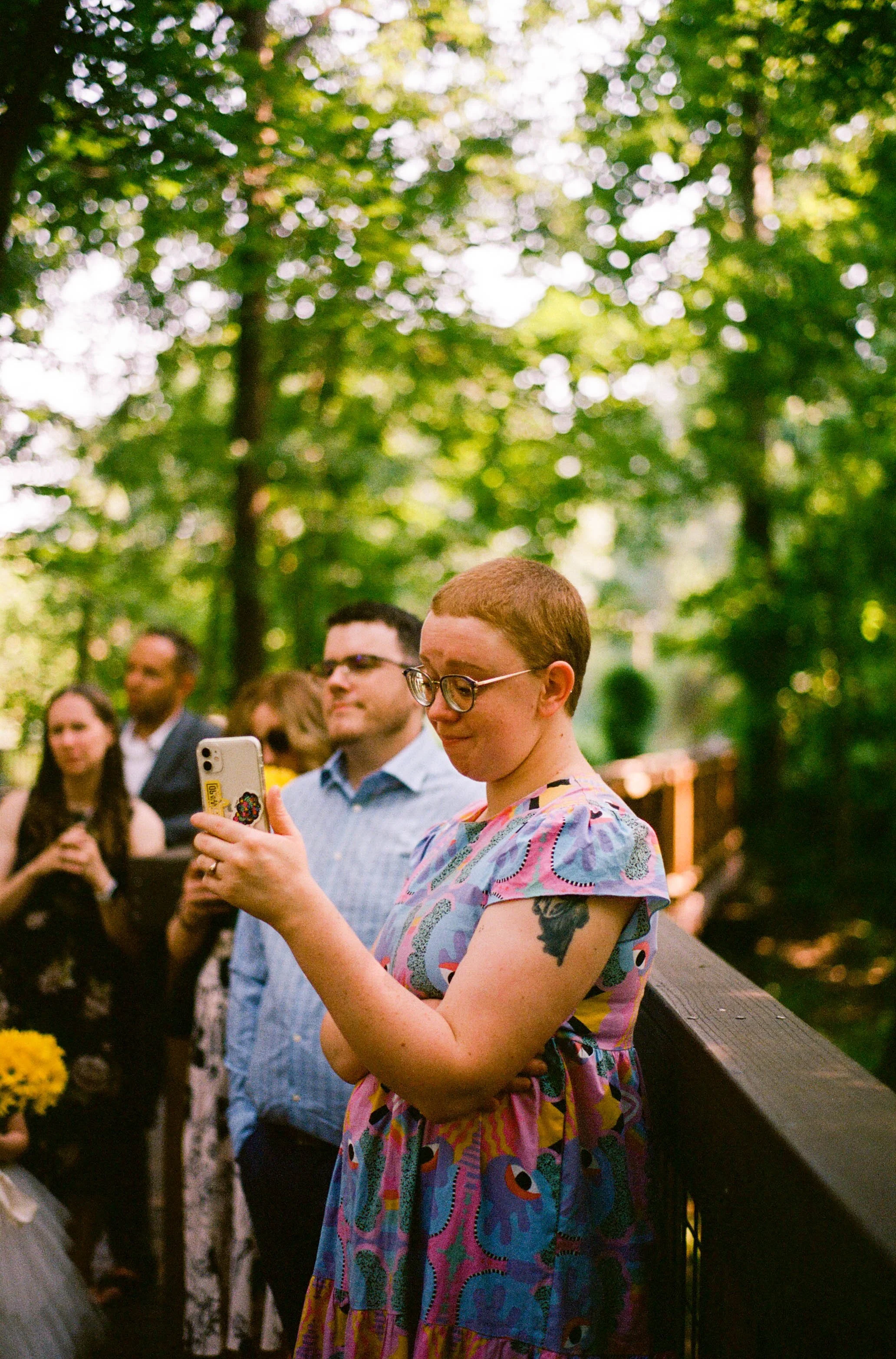 REW45-woman-filming-on-iphone-at-wedding.jpg