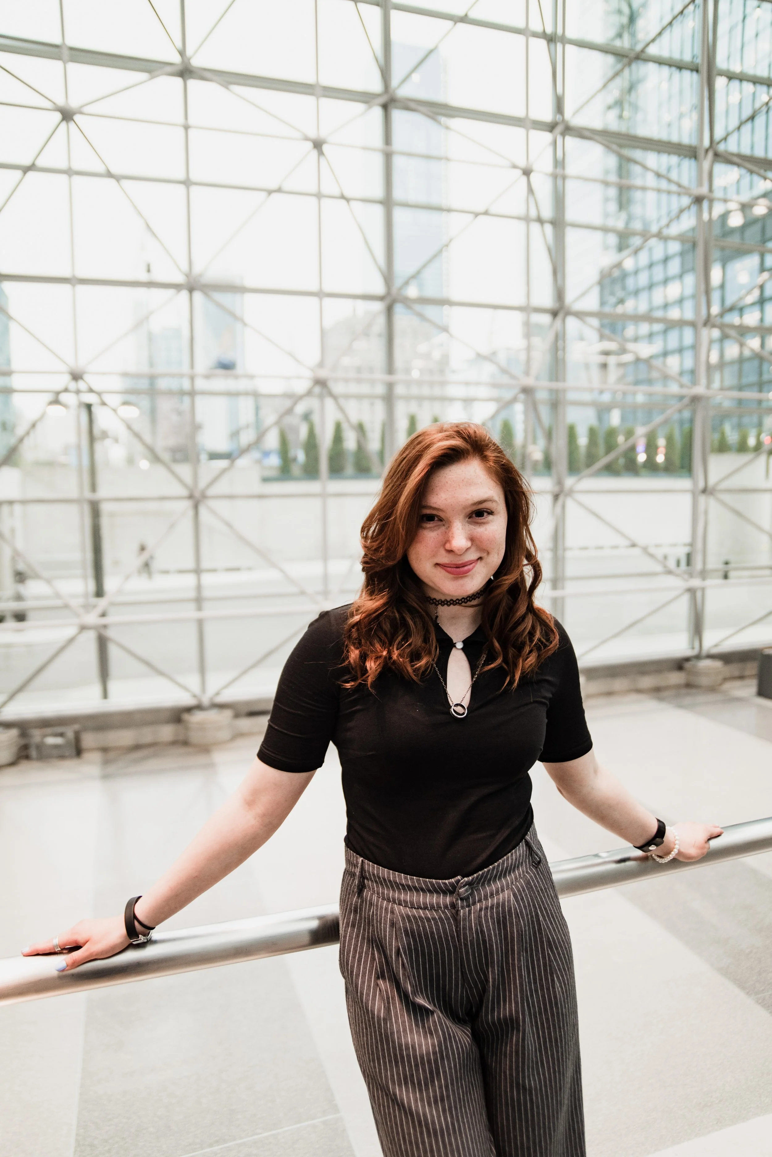 BT265-woman-arms-on-railing-at-javits-center.jpg