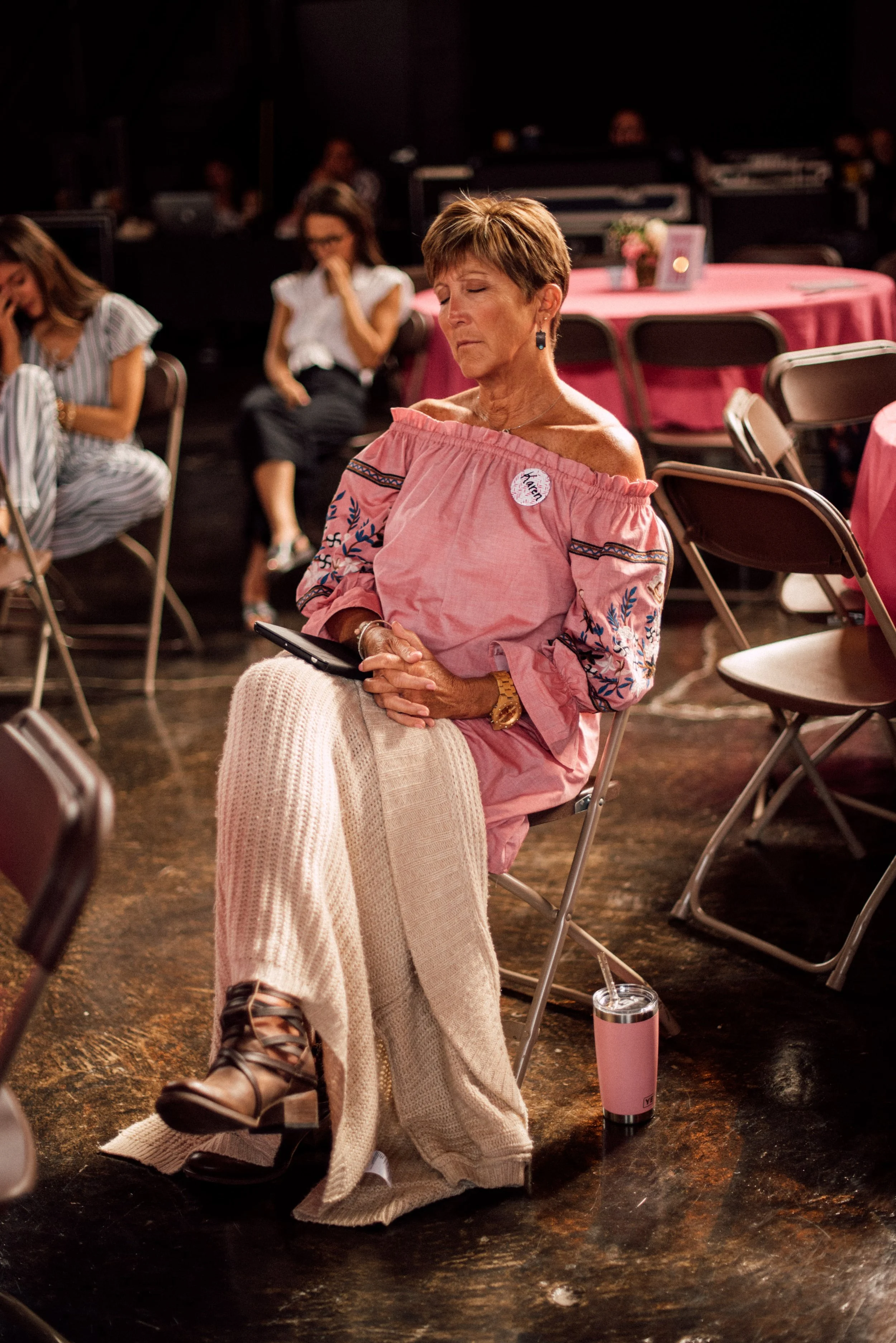 d248-woman-praying-at-conference.jpg