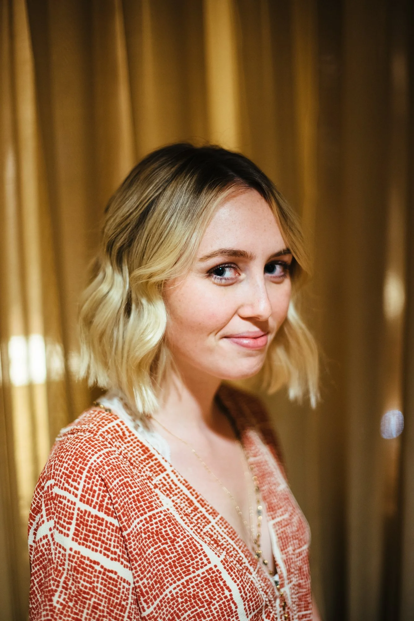 BT148-blonde-woman-smling-side-angle.jpg