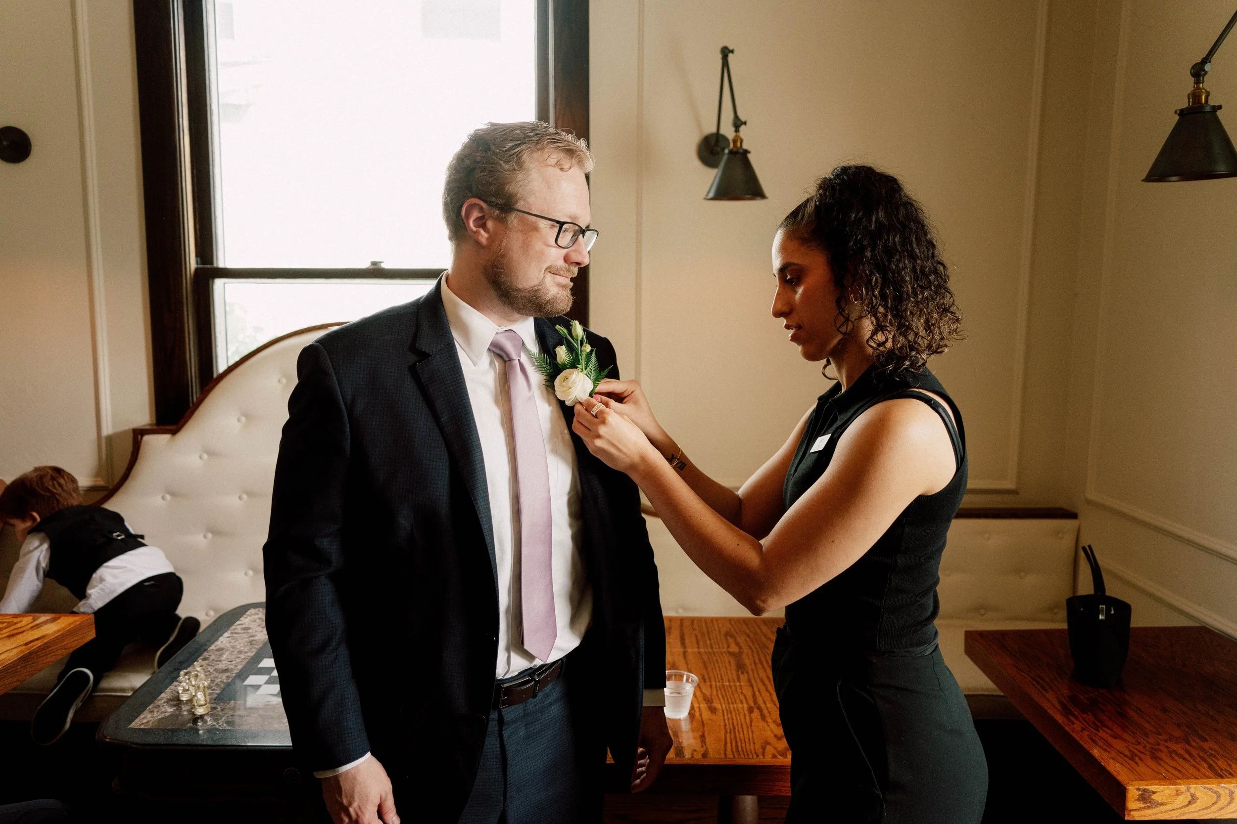 HRD17-woman-putting-on-boutonniere.jpg