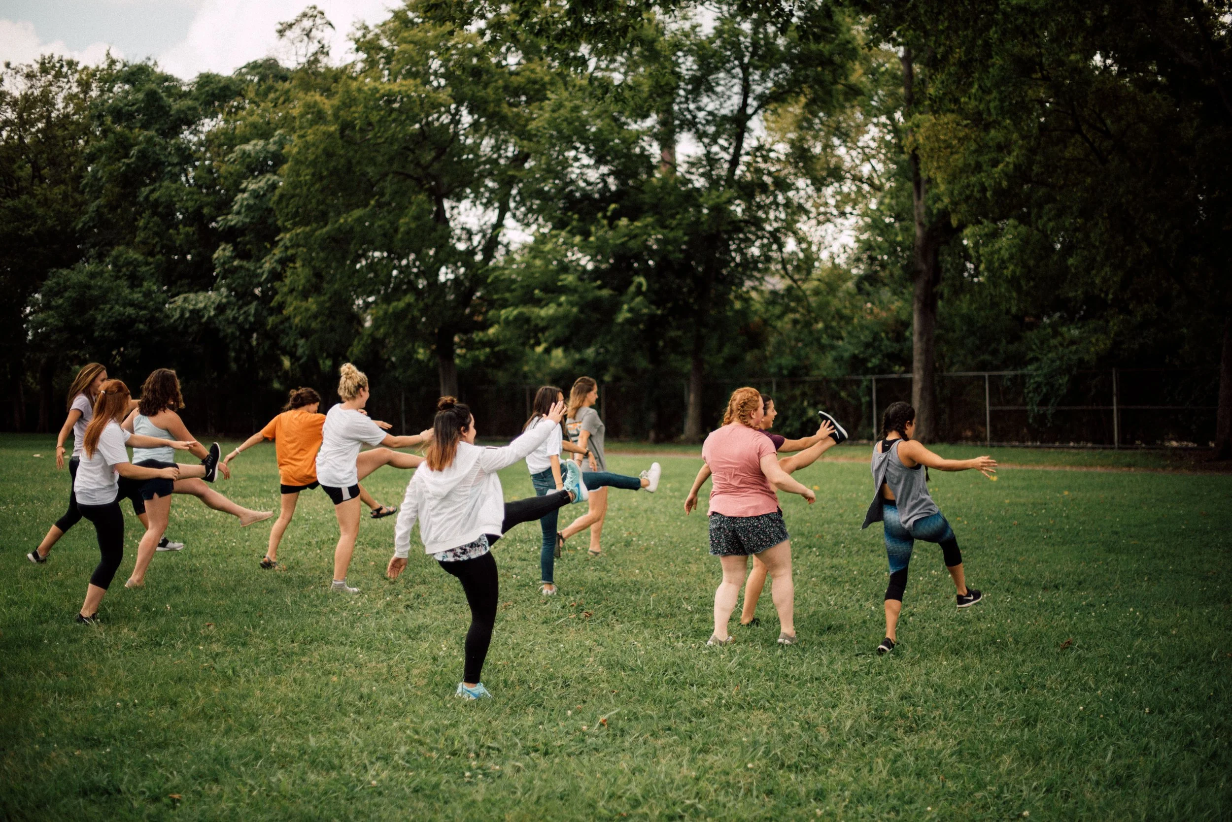 d227-women-stretching-in-field.jpg