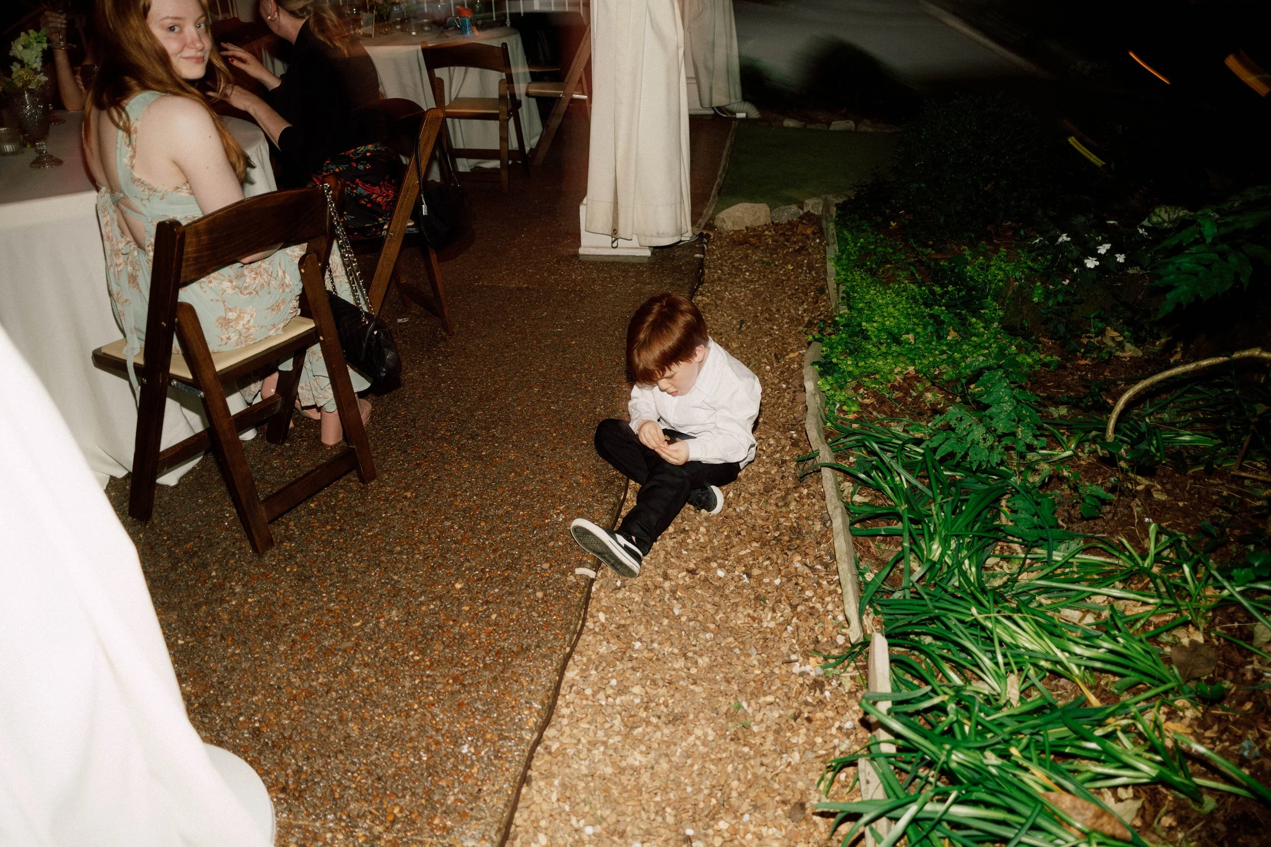 HRD75-little-boy-on-ground-at-wedding.jpg