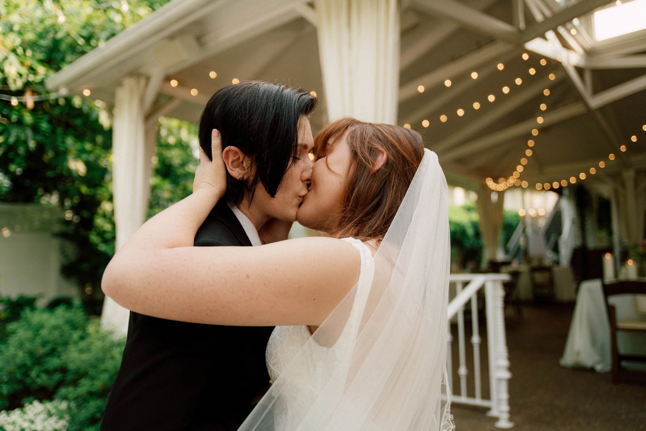 HRD33-two-brides-kissing-after-lgbtq-wedding.jpg