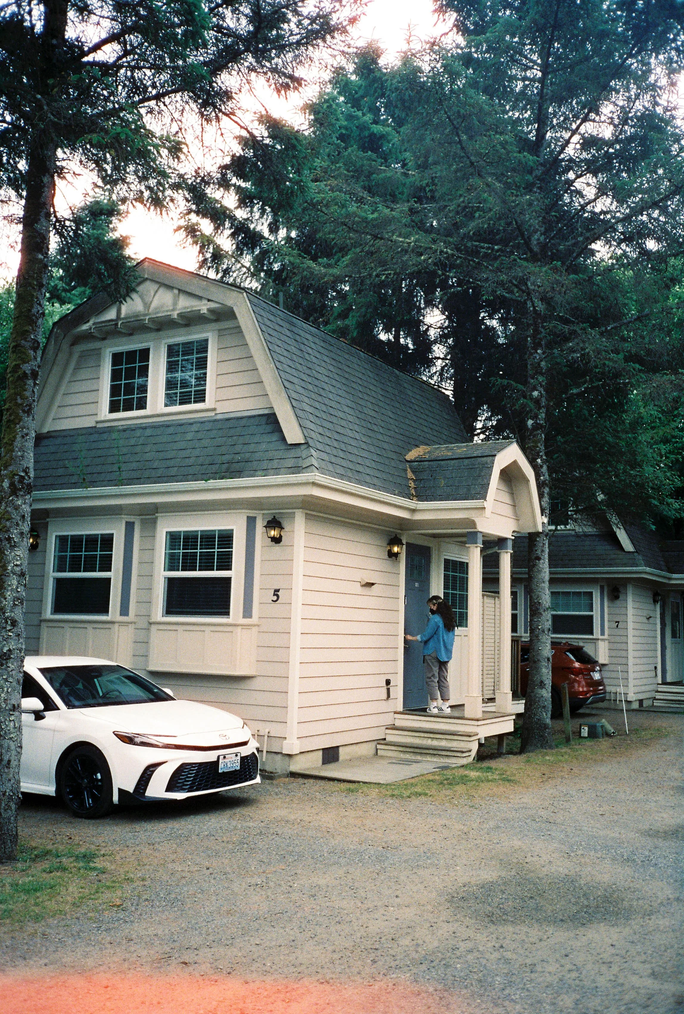 pnw84-cottage-house-car-woman-at-door.jpg