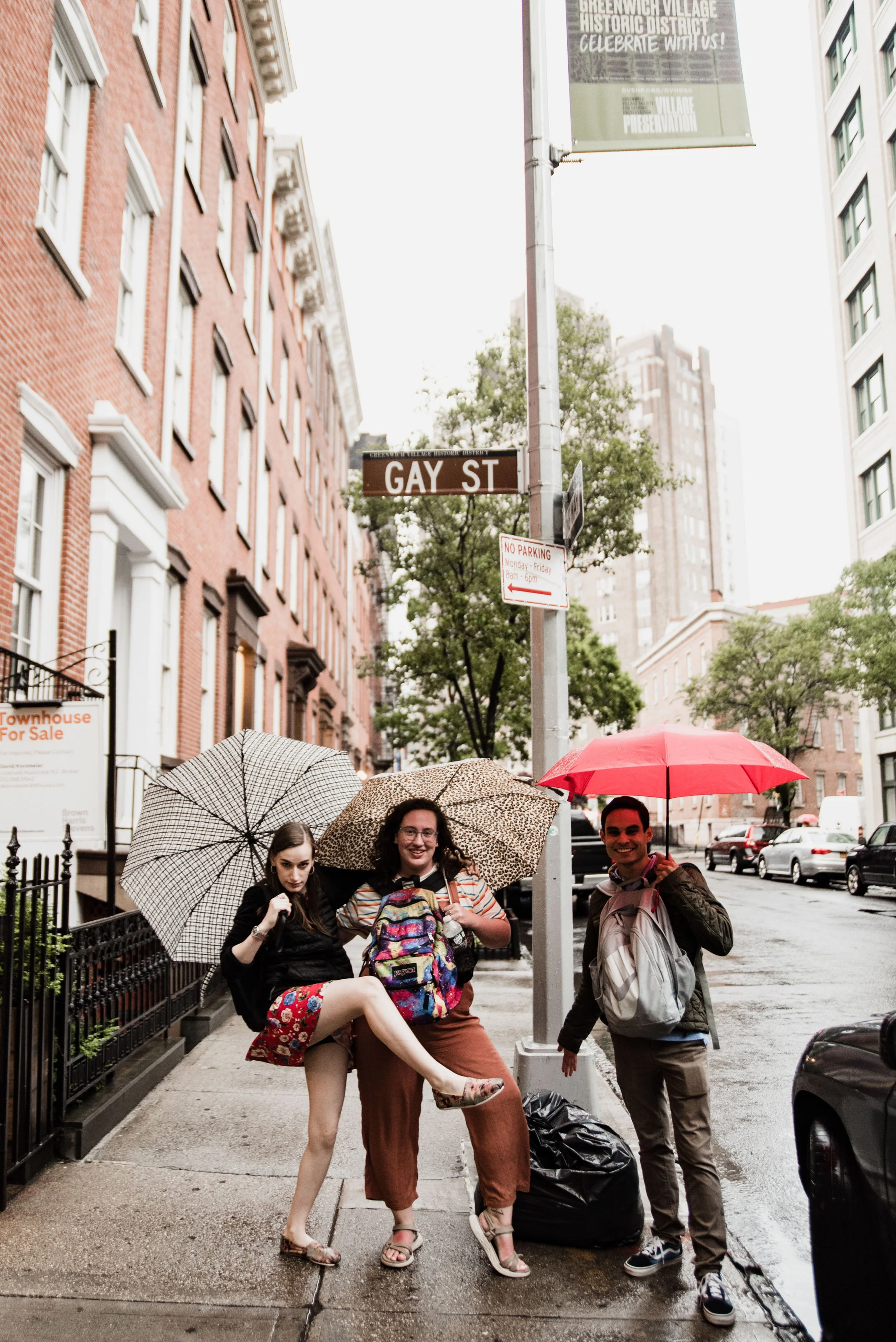 BT271-three-people-with-umbrellas-under-gay-st.jpg