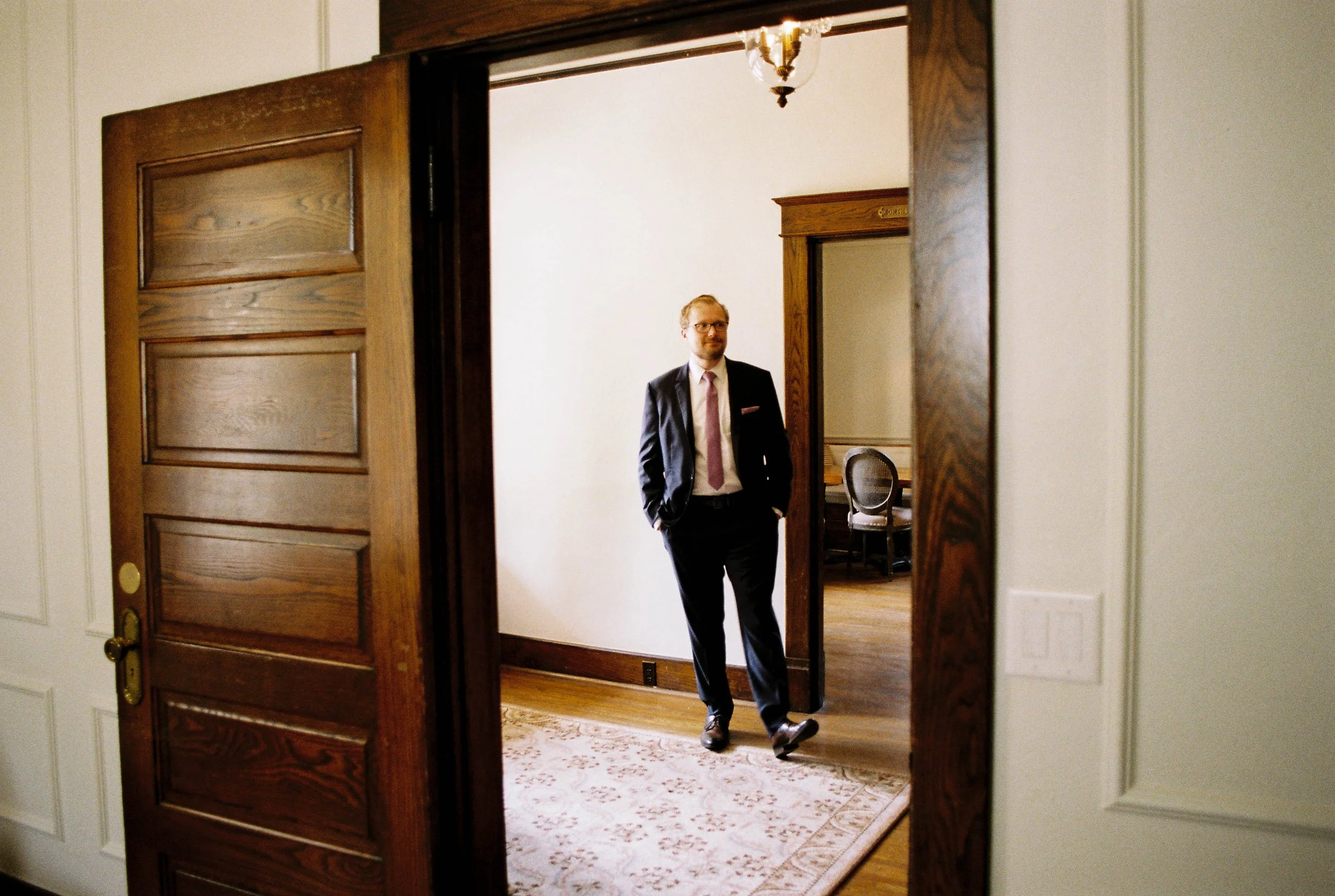 HRF19-groomsman-waiting-in-hall.jpg