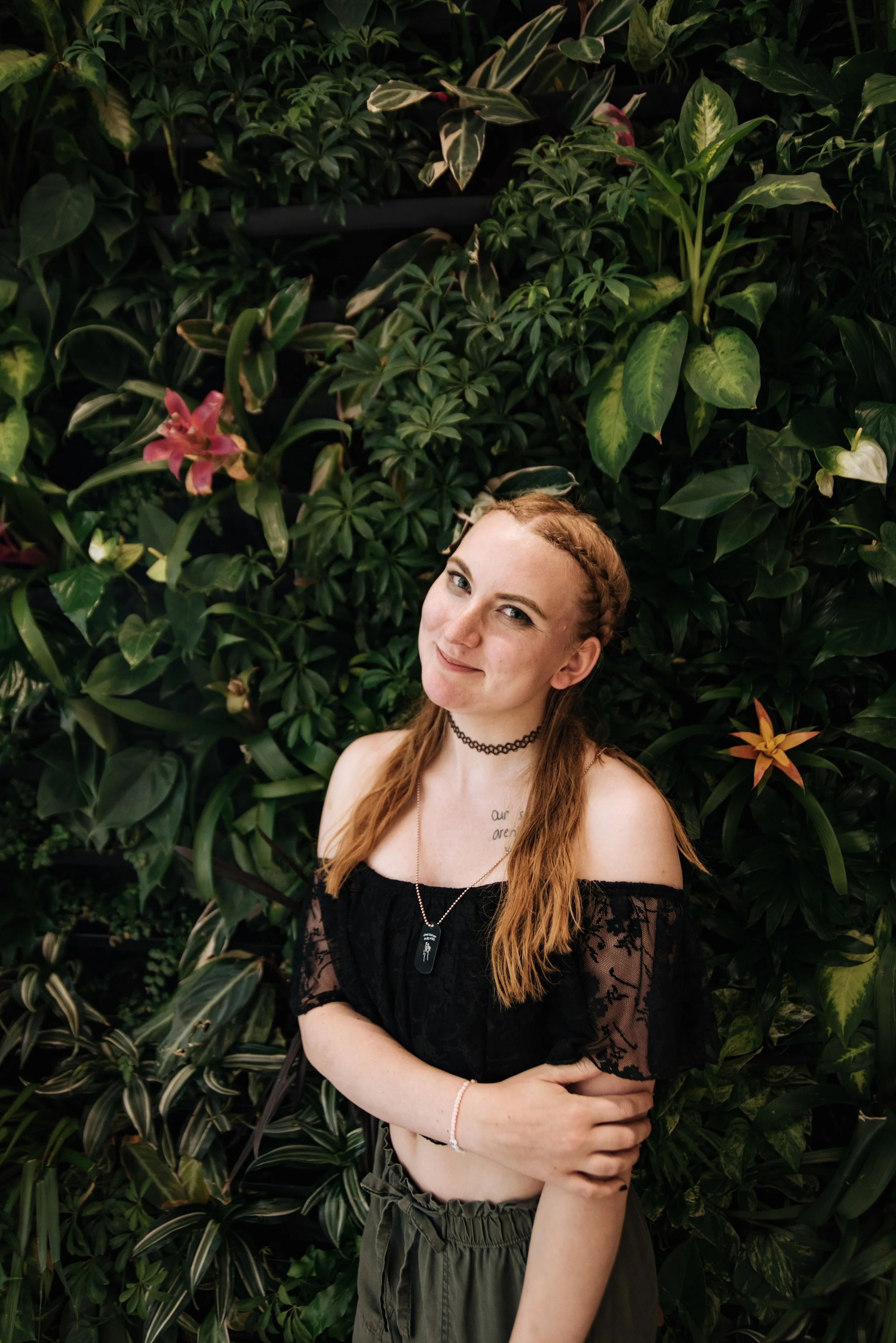 BT258-woman-braid-in-hair-posing-greenery.jpg