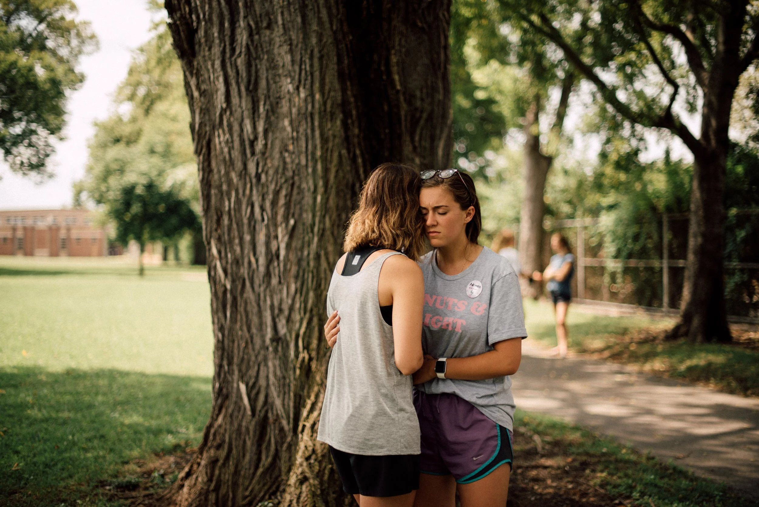 d239-women-praying-by-tree.jpg