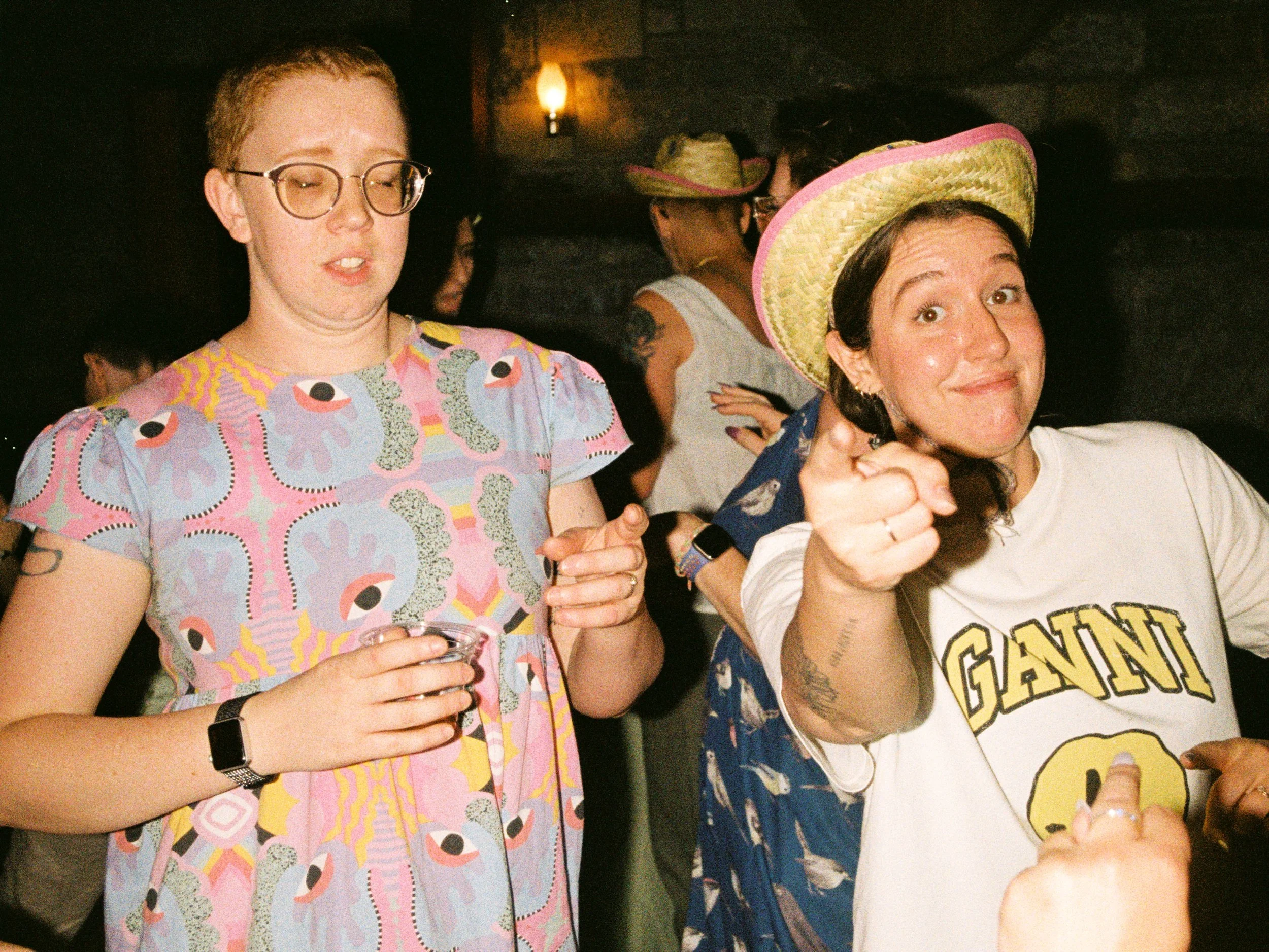 REW97-woman-pointing-at-camera-smiling.jpg