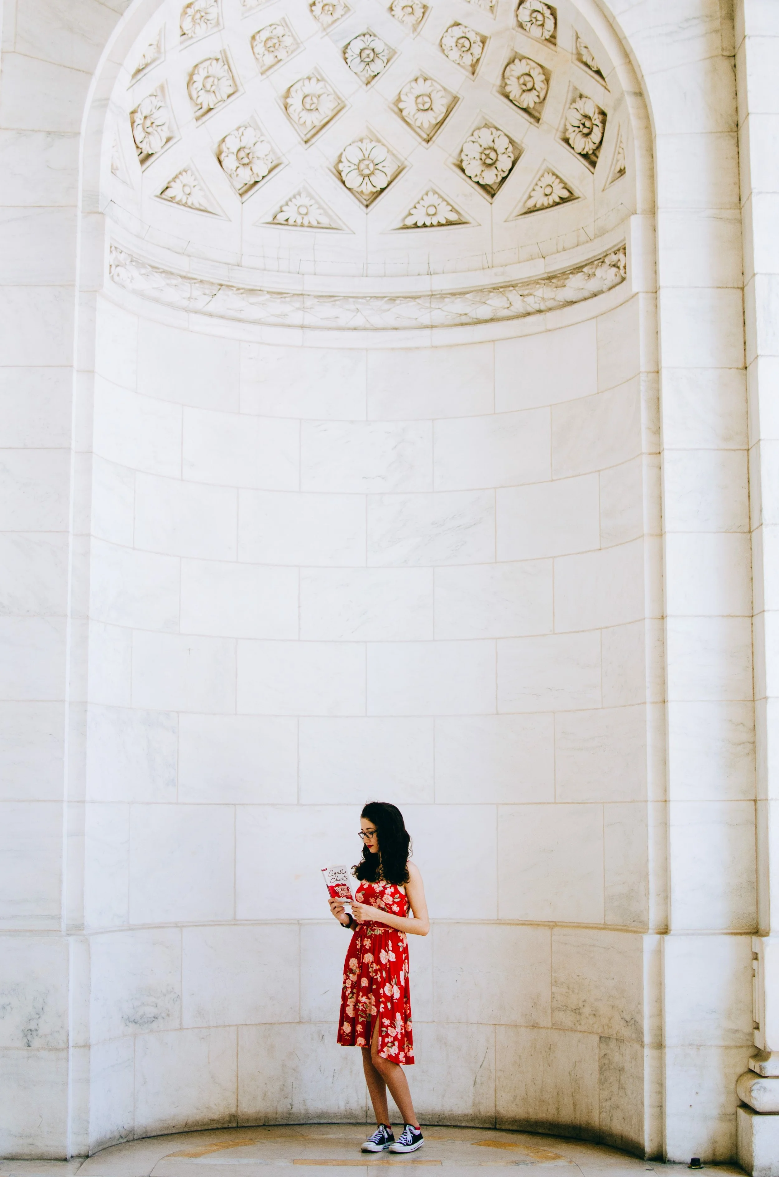 BT169-woman-reading-book-red-dress-ny-public-library.jpg
