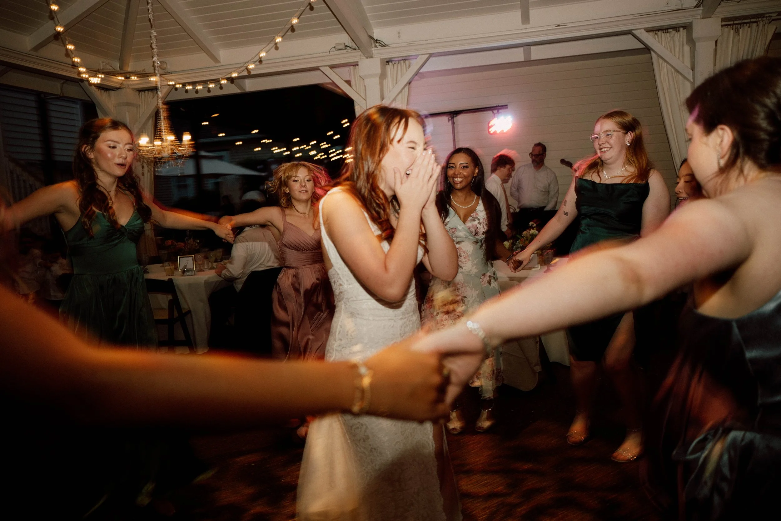 HRD79-bride-in-circle-dancing-laughing.jpg