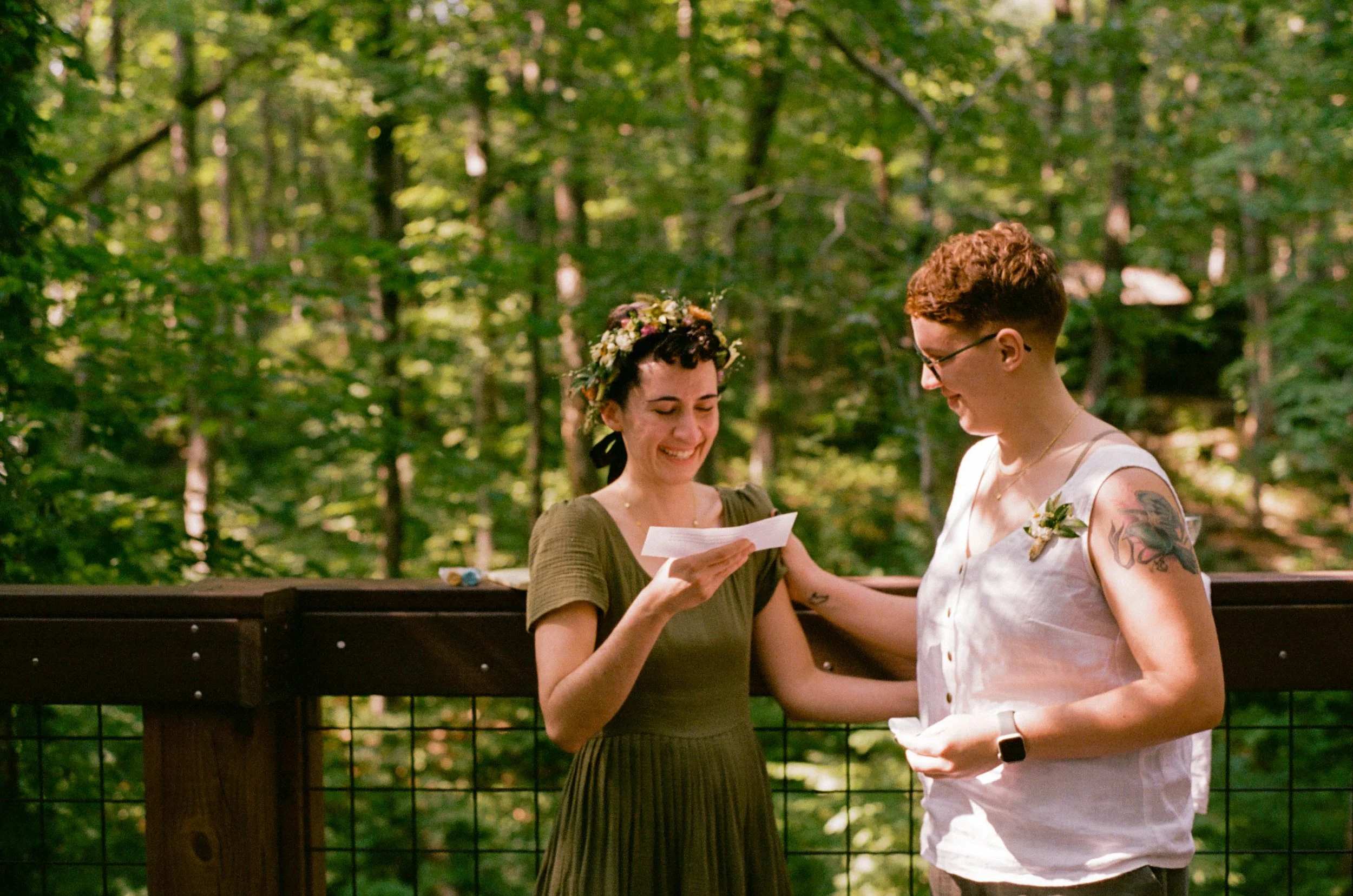 REW56-women-smiling-at-lgbtq-wedding-ceremony.jpg