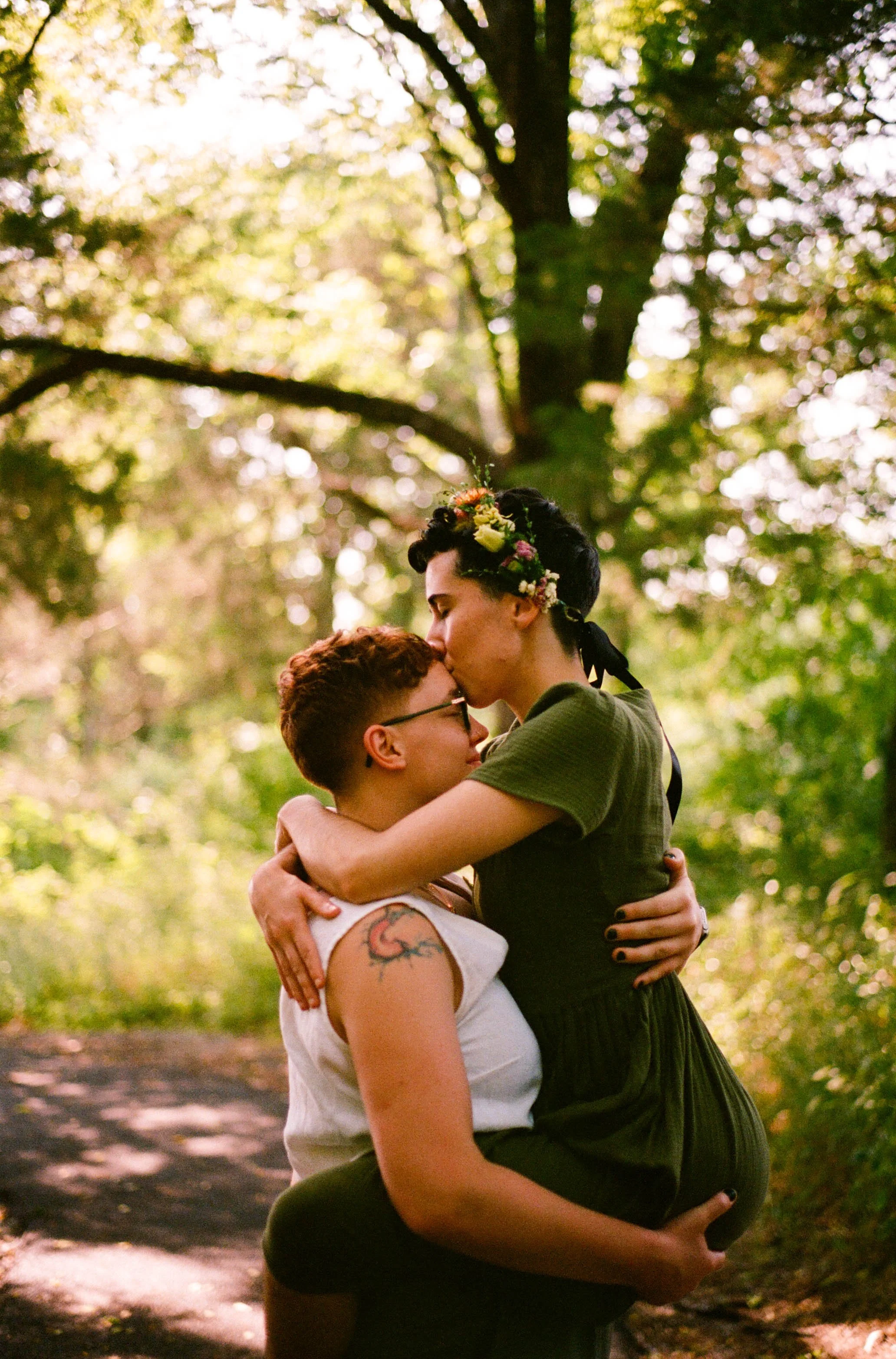 REW32-women-holding-each-other-forehead-kiss.jpg