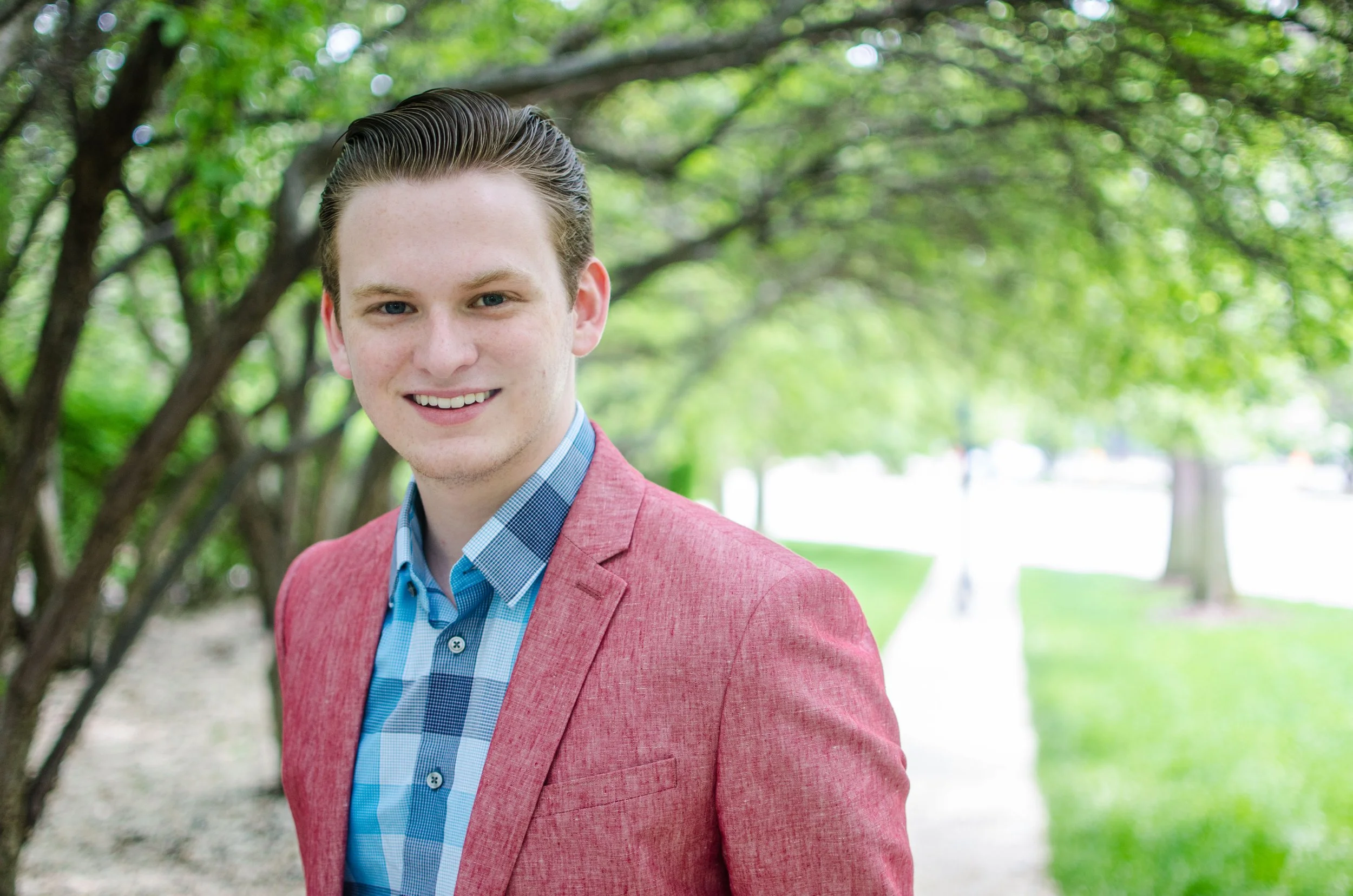 BT68-man-in-pink-blazer-under-trees.jpg