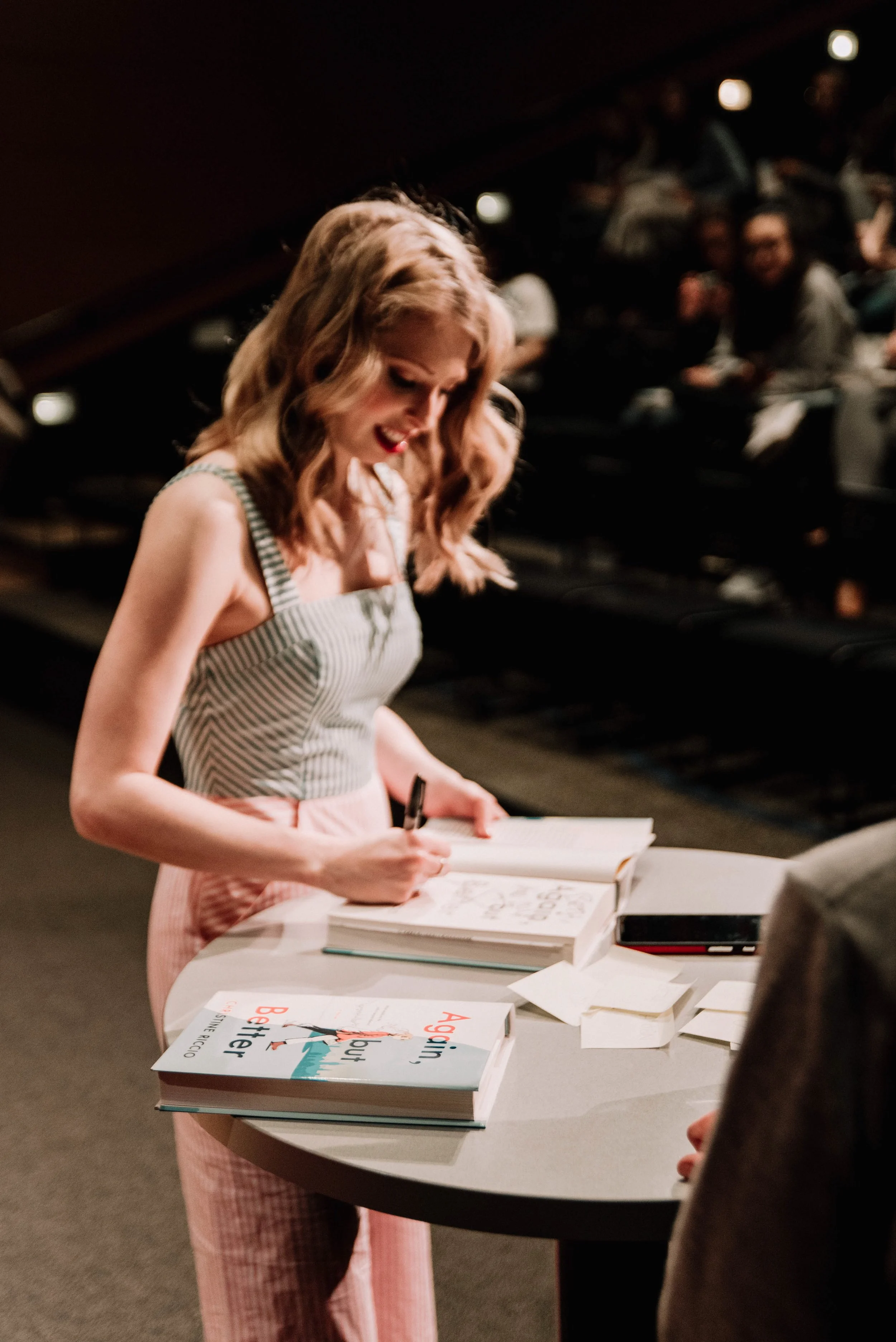 BT236-woman-signing-book.jpg