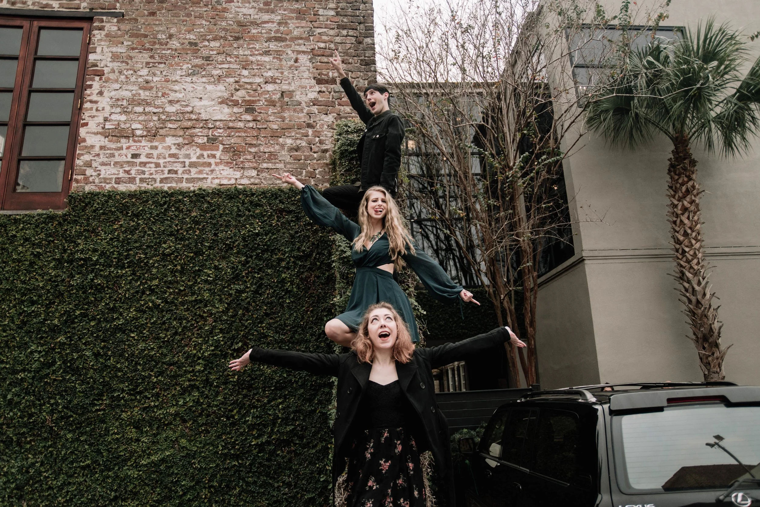 BT139-booksplosion-on-steps-arms-up.jpg