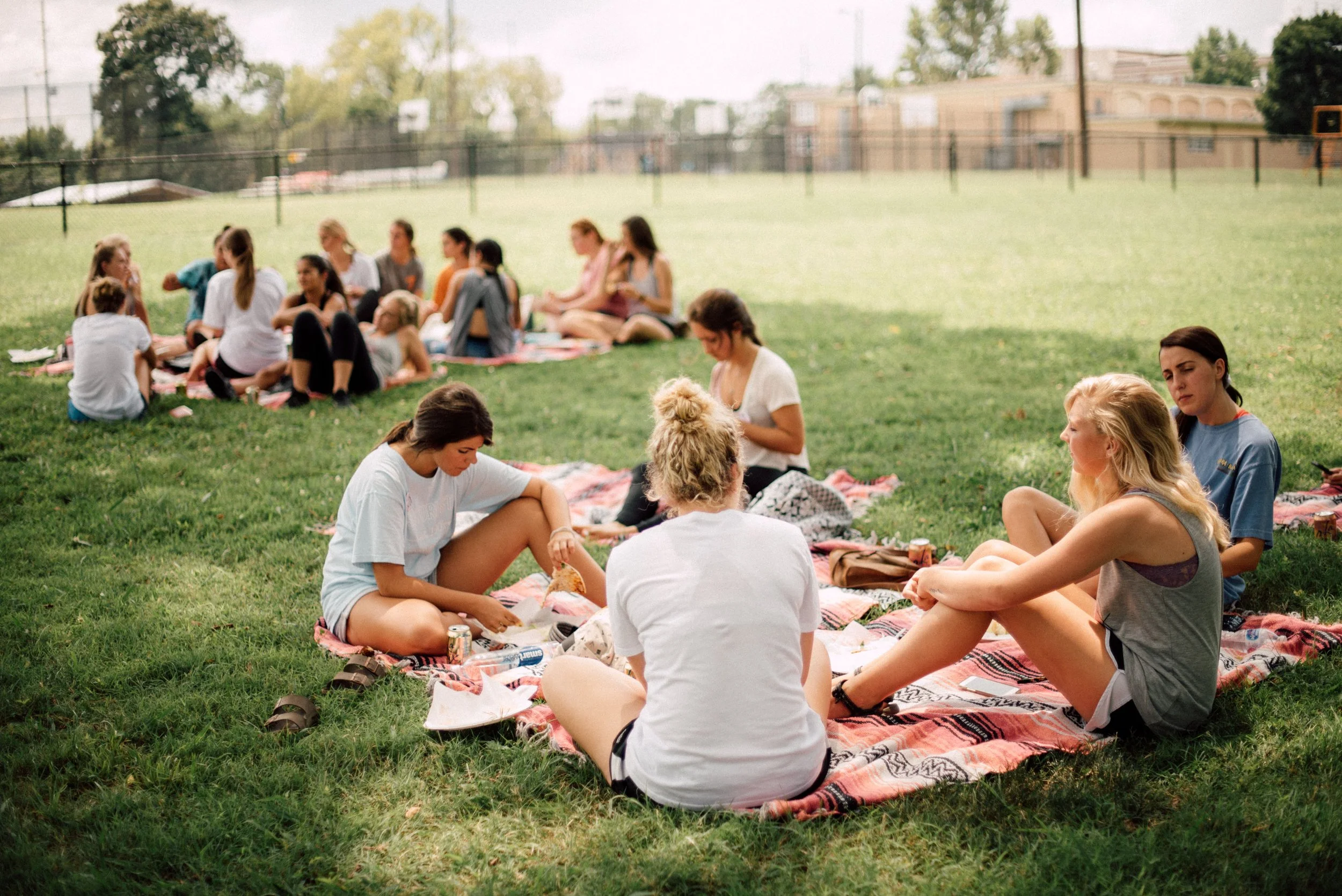 d238-women-sitting-on-blankets-smiling.jpg