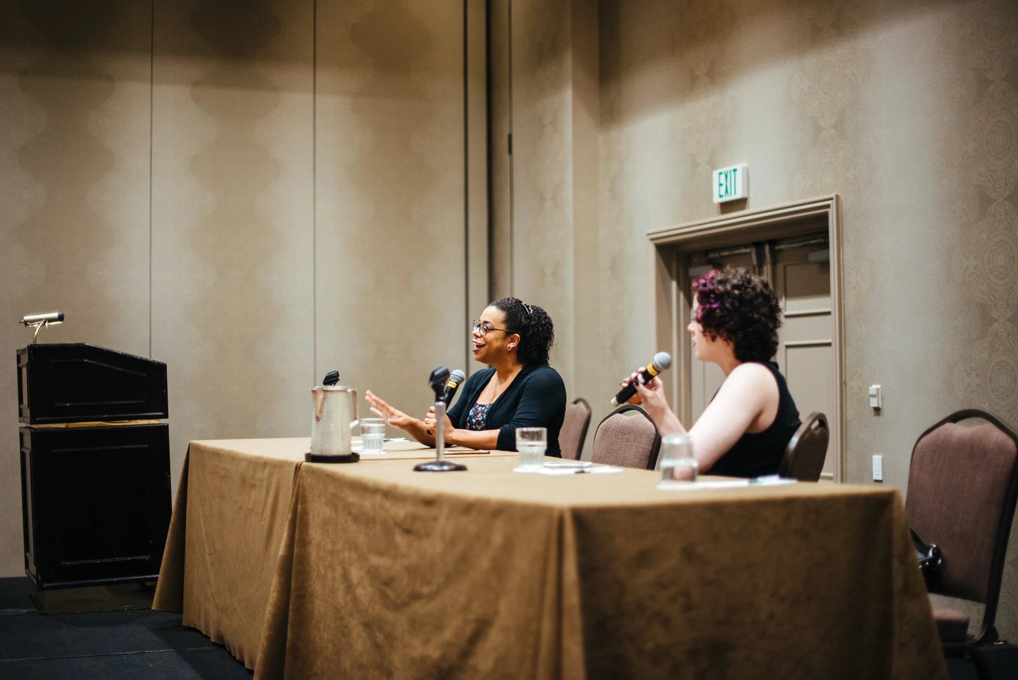 BT118-woman-speaking-on-panel.jpg