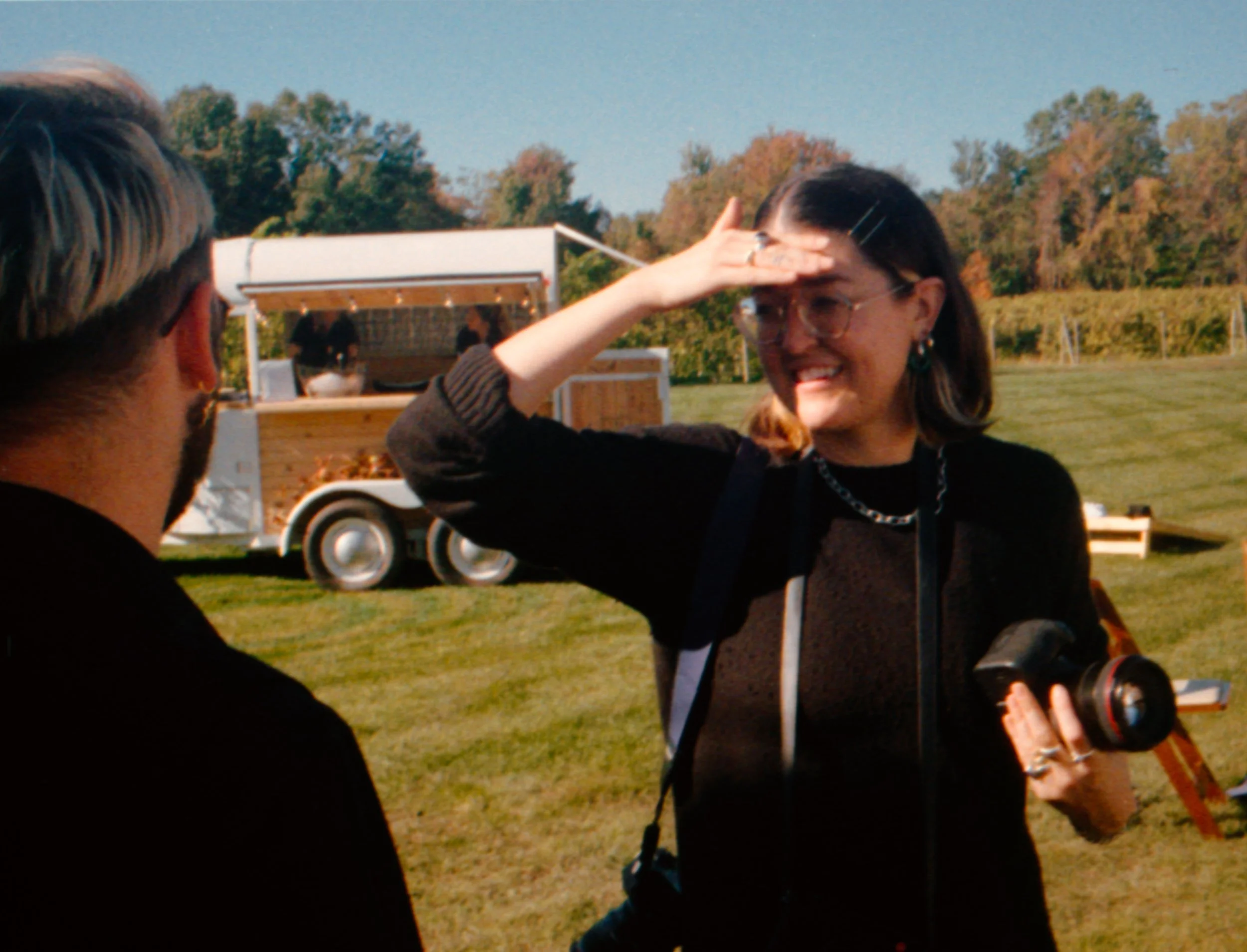LBW84-wedding-photographer-shielding-eyes-from-sun.jpg
