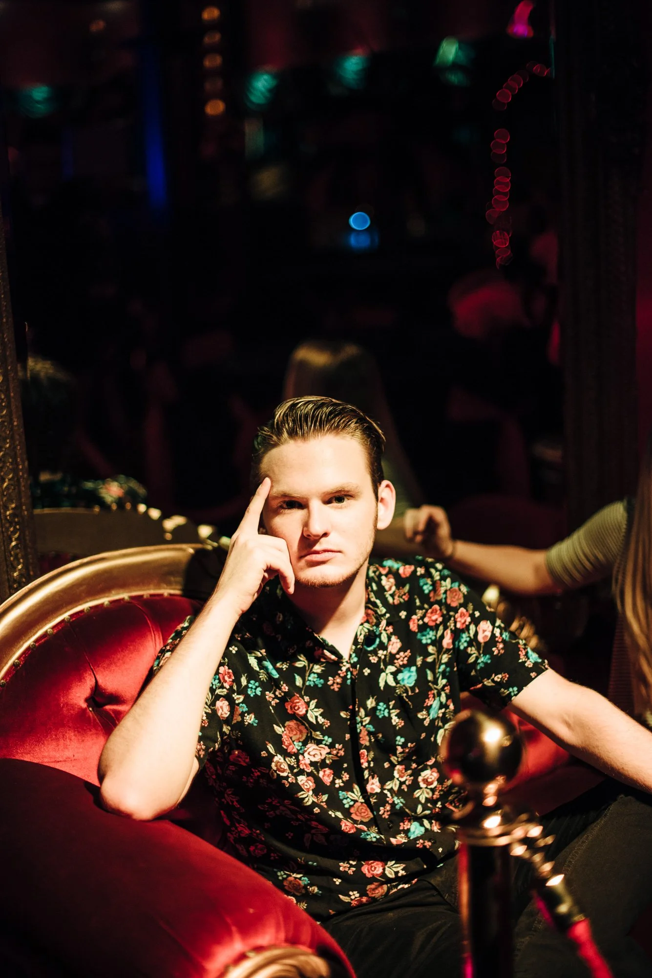 BT183-white-man-on-red-couch-dramatic-lighting.jpg