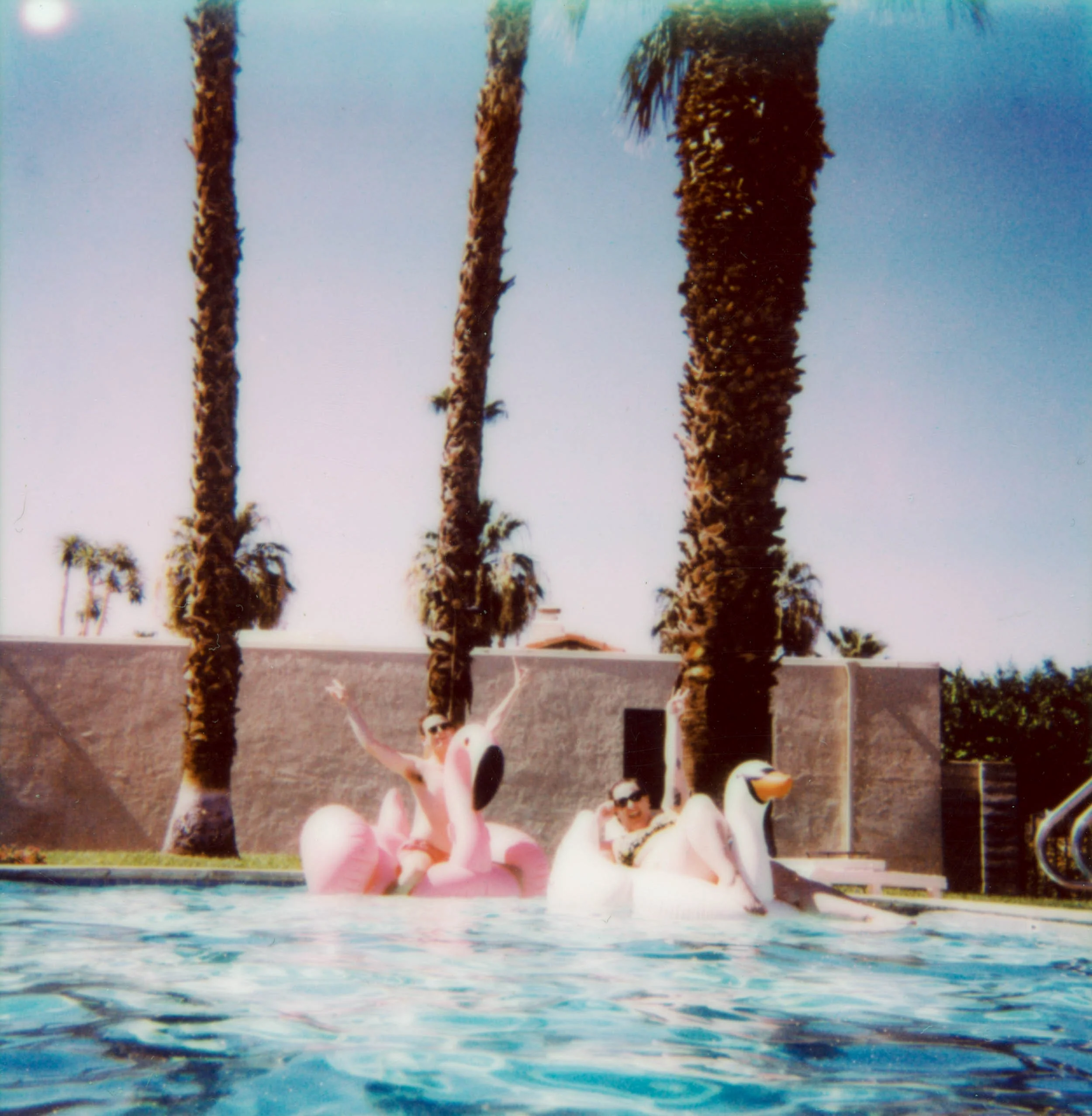 BT56-polaroid-two-people-floating-in-pool.jpg