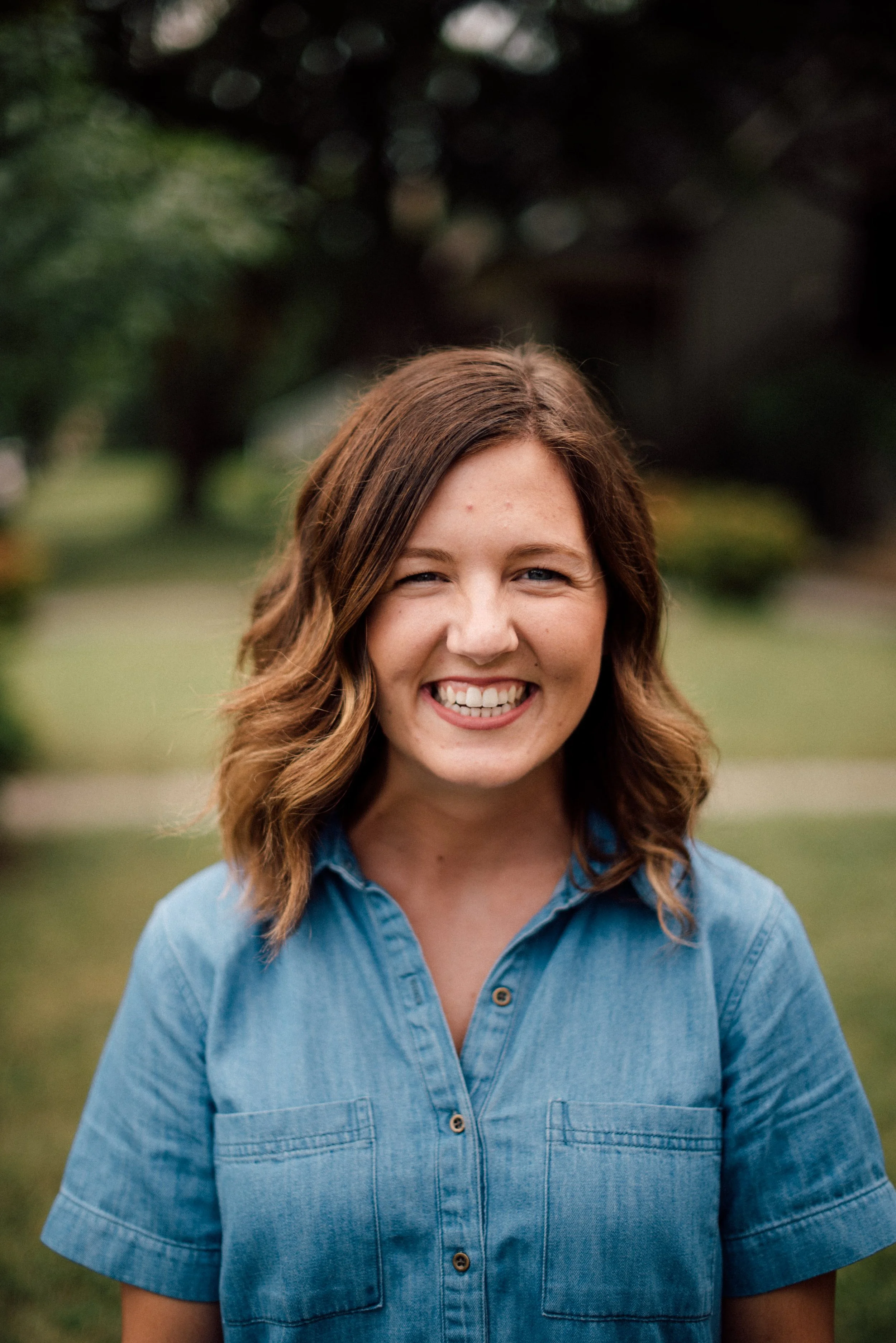 d201-headshot-woman-smiling-denim.jpg