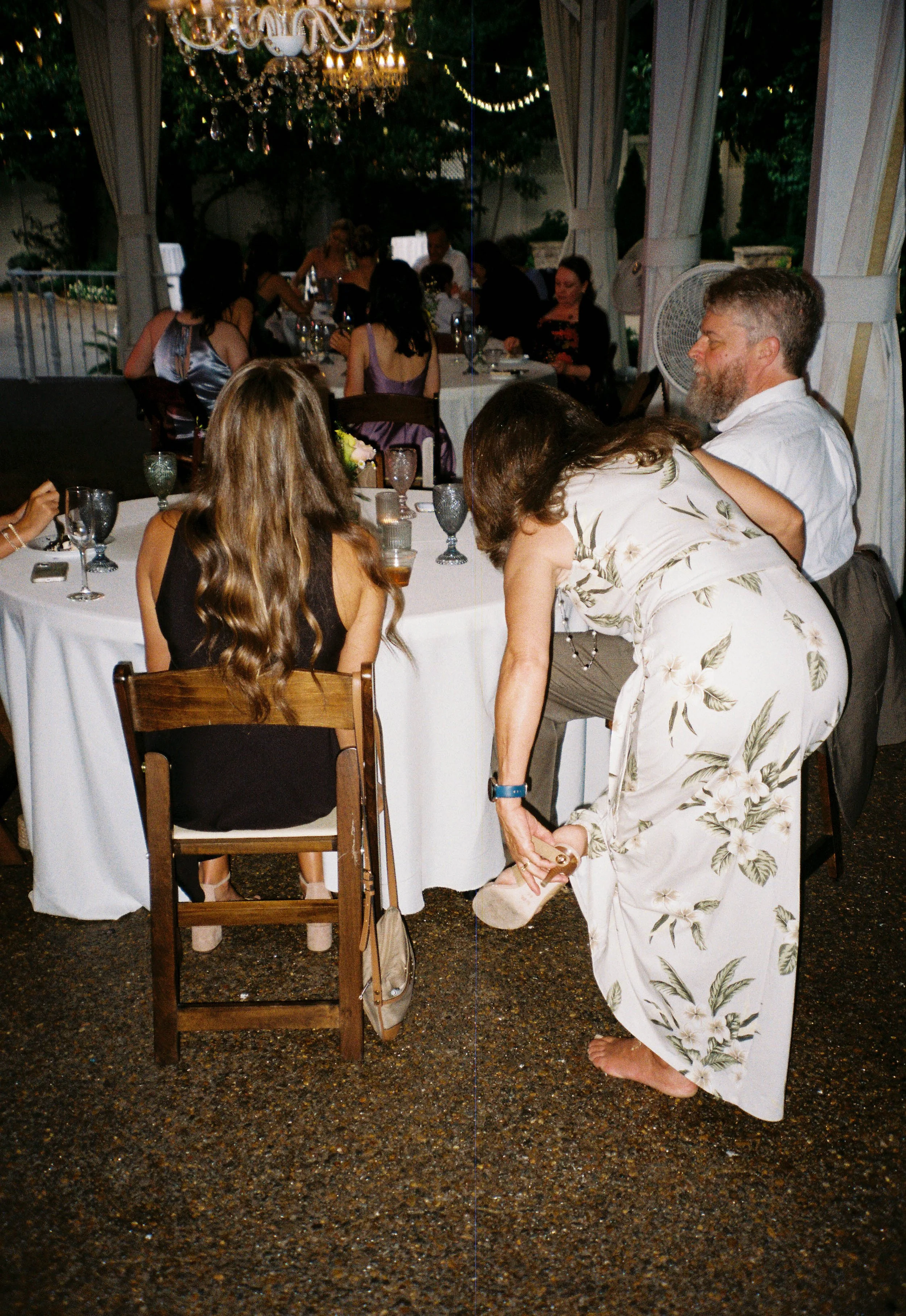 HRF81-woman-taking-off-shoe-at-wedding.jpg