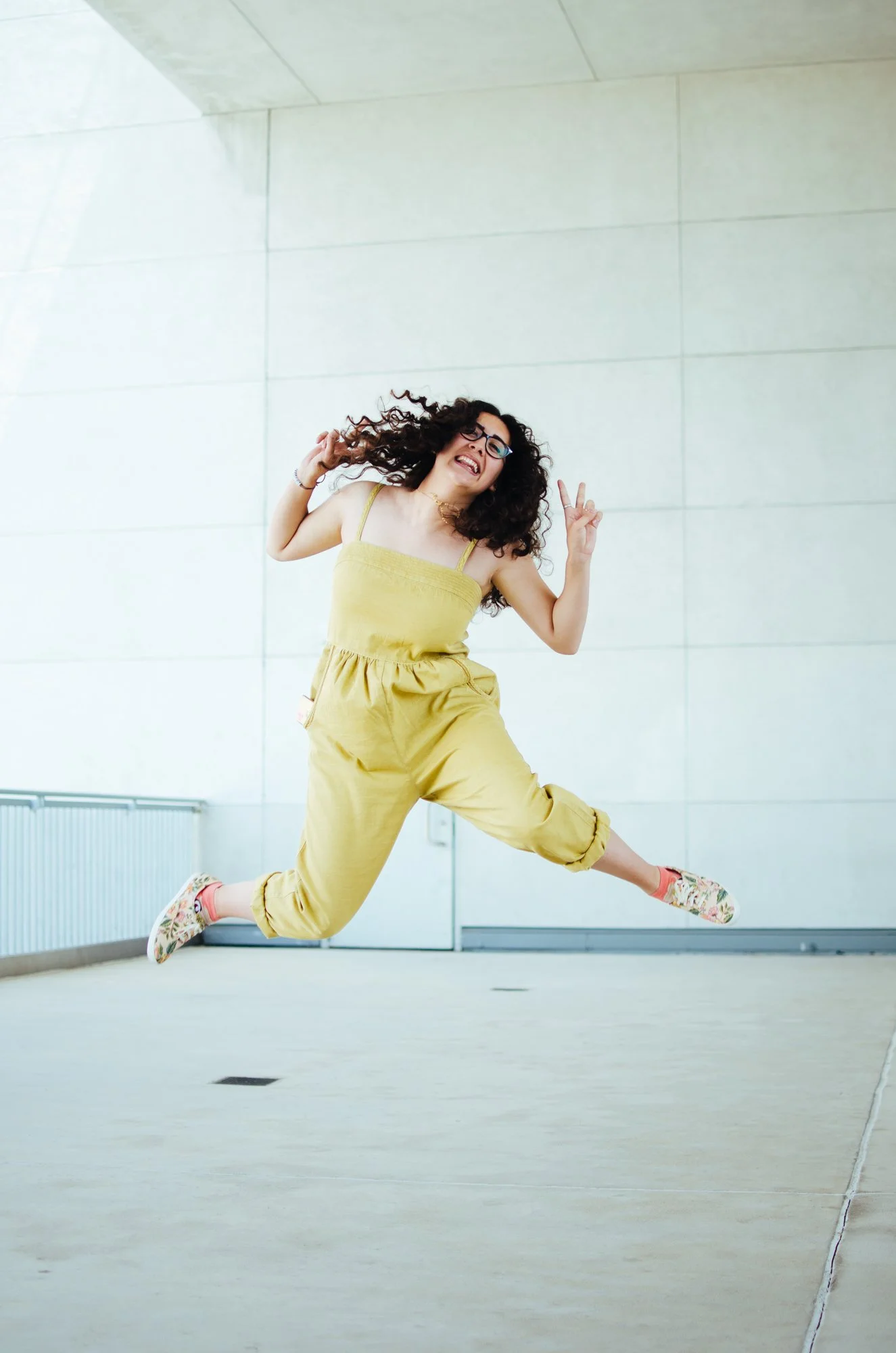BT41-woman-curly-hair-yellow-jumpsui.jpg