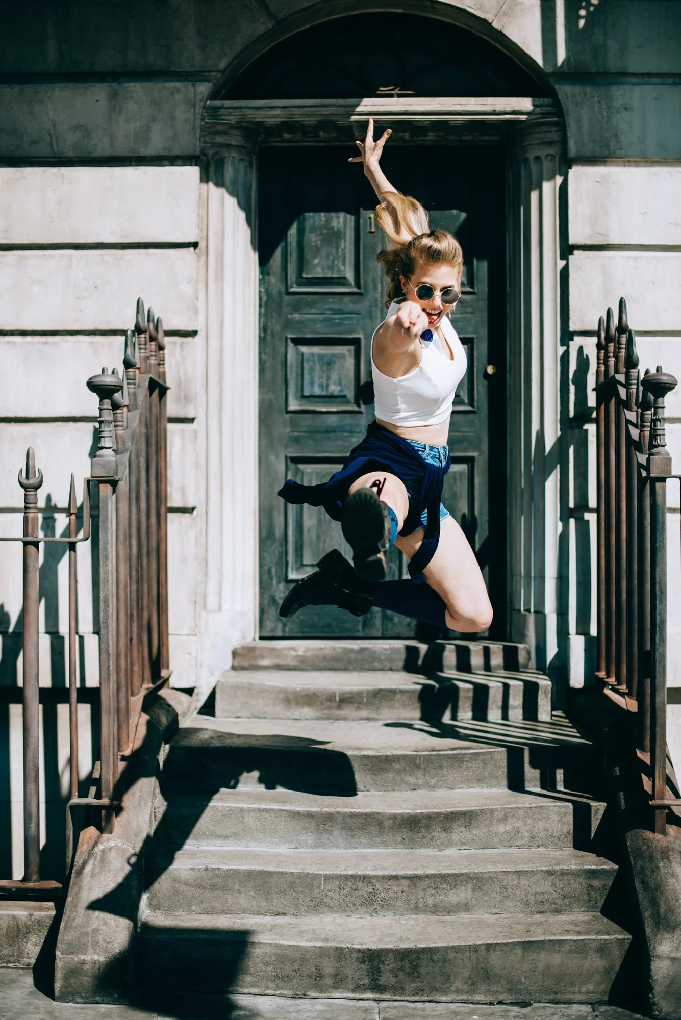BT88-woman-jumping-with-magic-wand-sunglasses.jpg