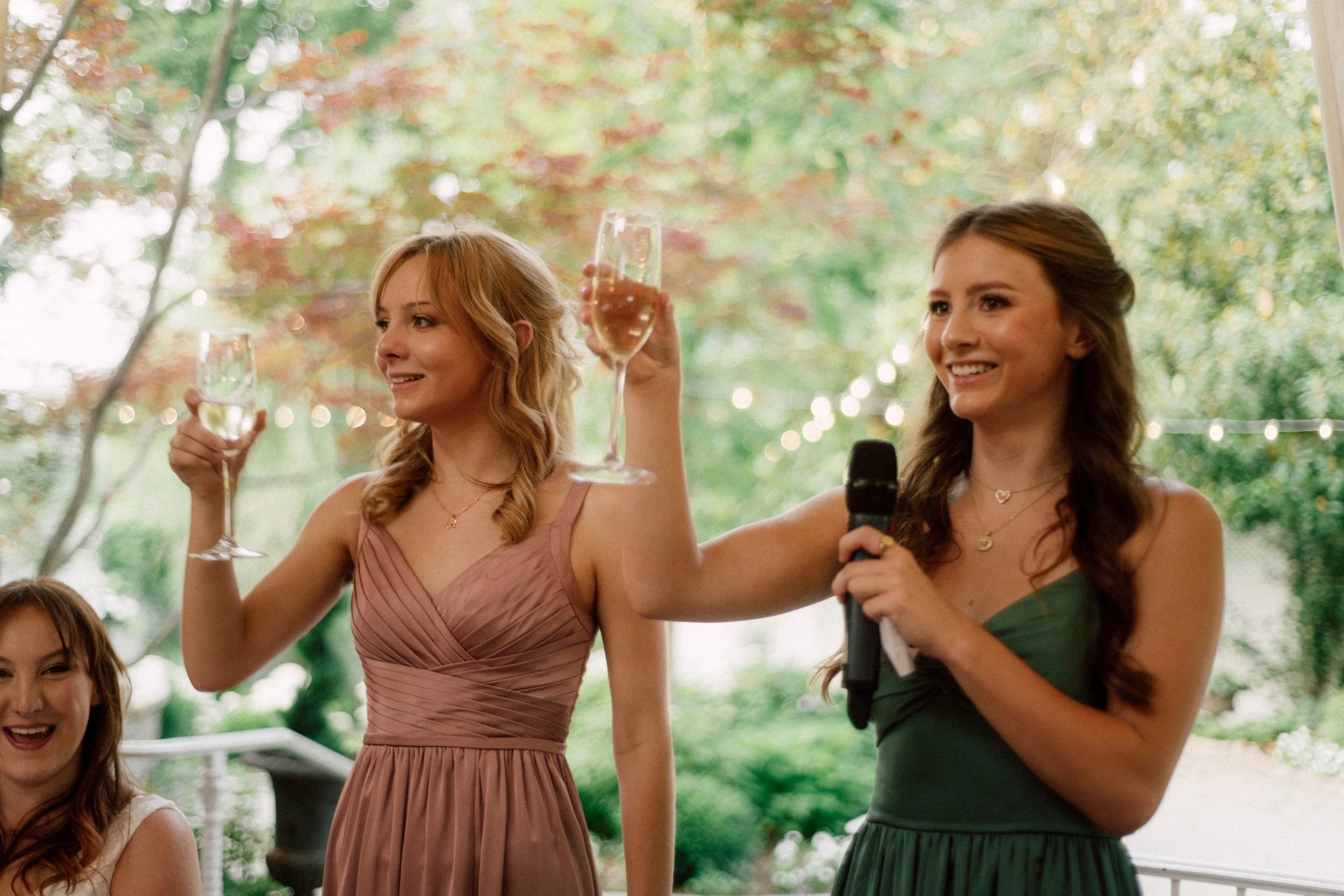 HRD56-sisters-of-the-bride-giving-toast.jpg