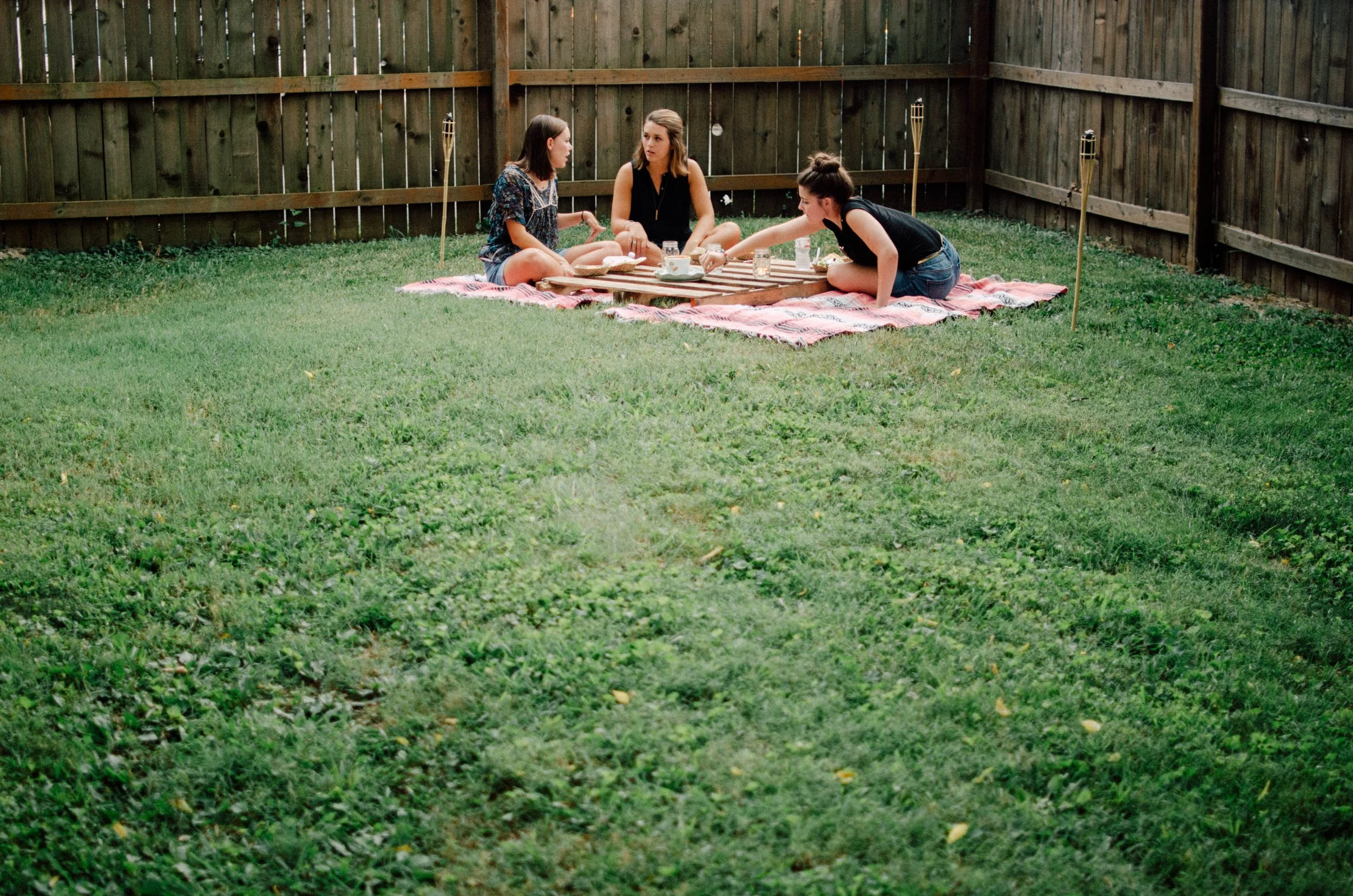 d161-women-on-blanket-in-grass-picnic.jpg