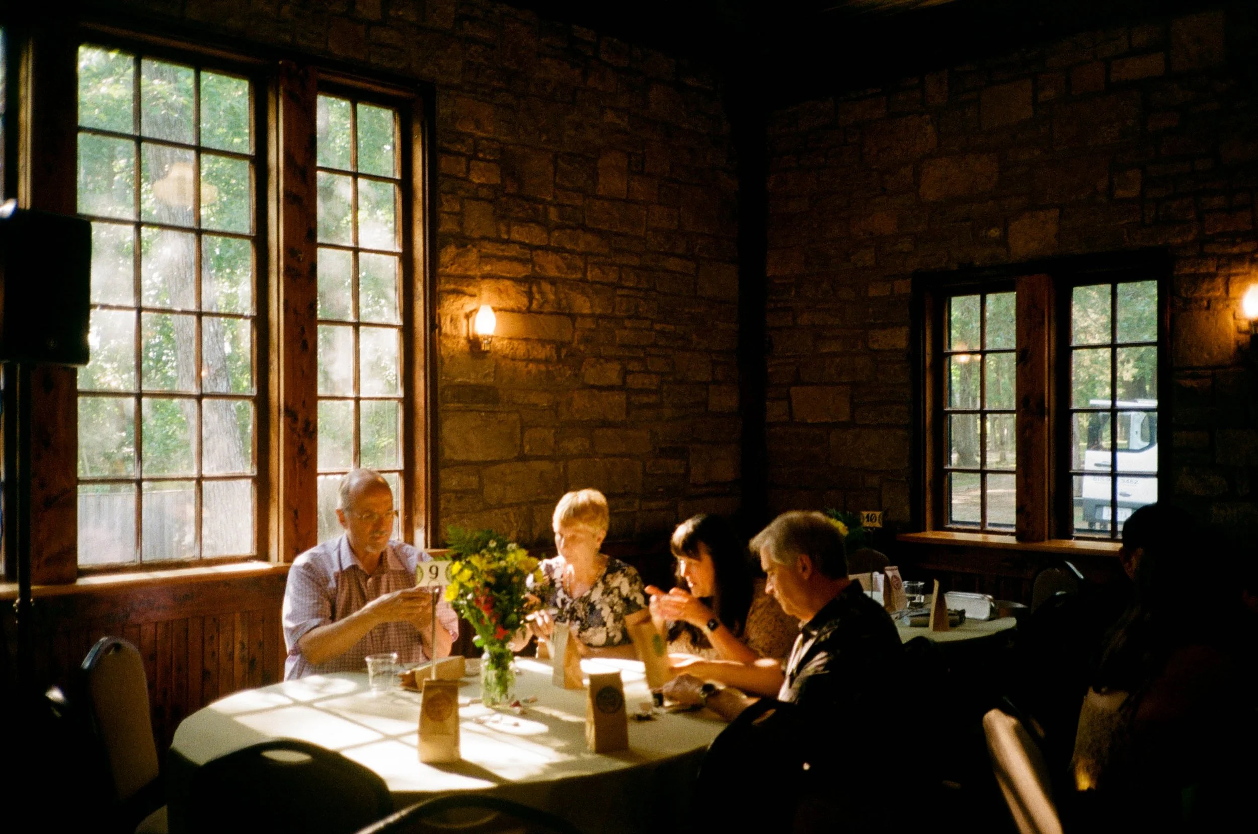 REW72-wedding-guests-sitting-at-table.jpg