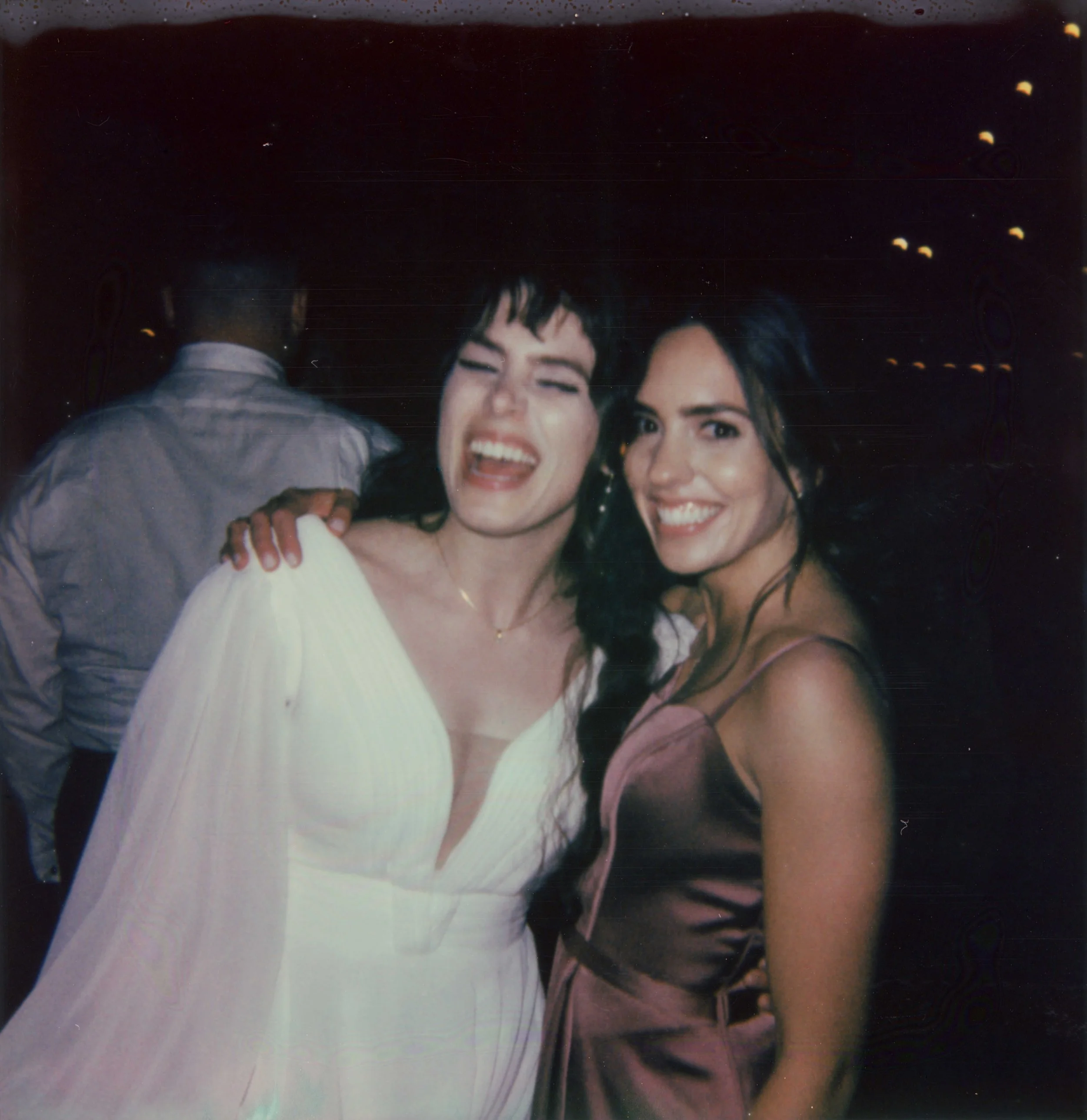 LBW124-wedding-polaroid-bride-sister-smiling.jpg